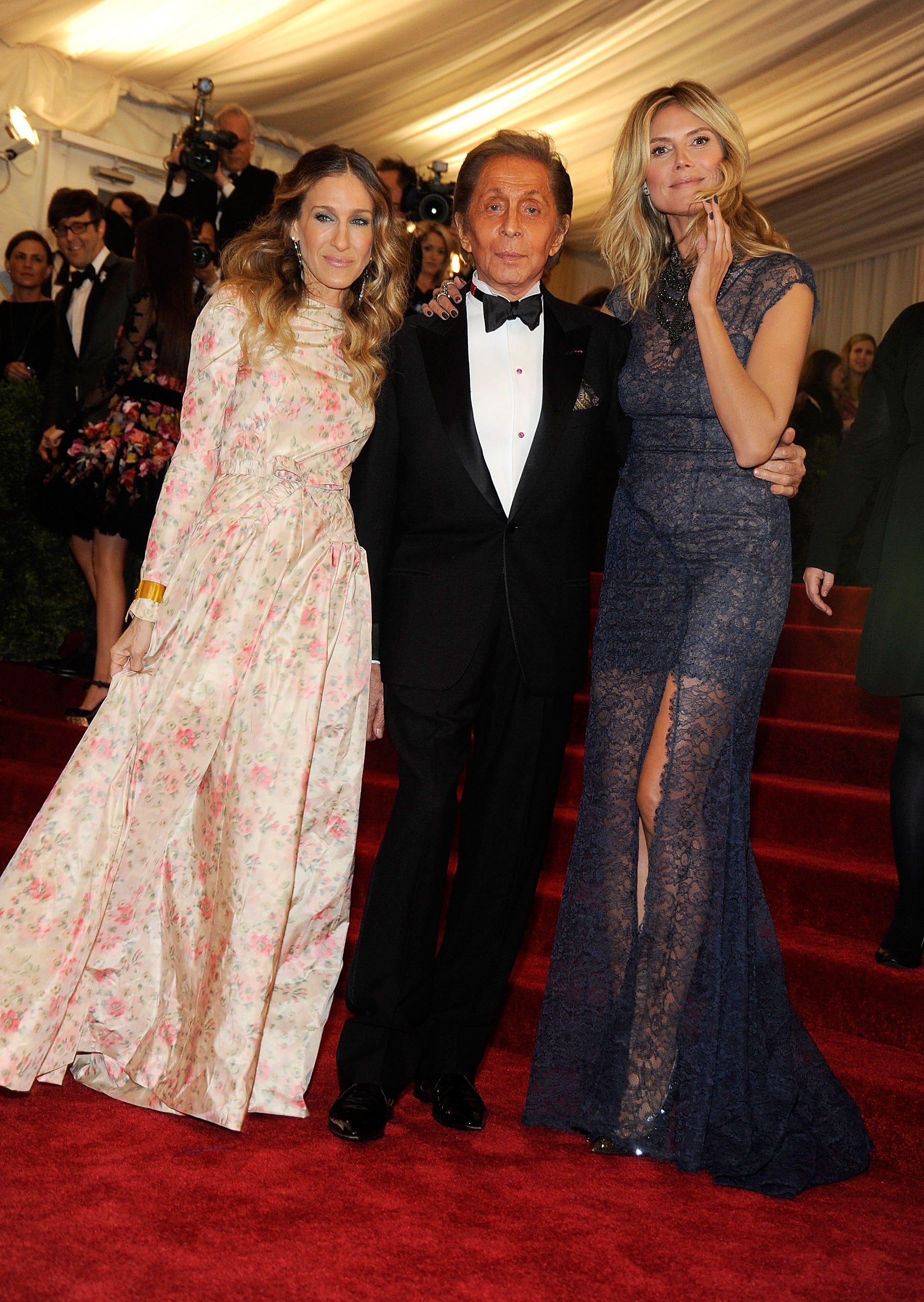  One successful  a floral gown, 1  successful  a tuxedo, and 1  successful  a lace formal  with a broadside  slit