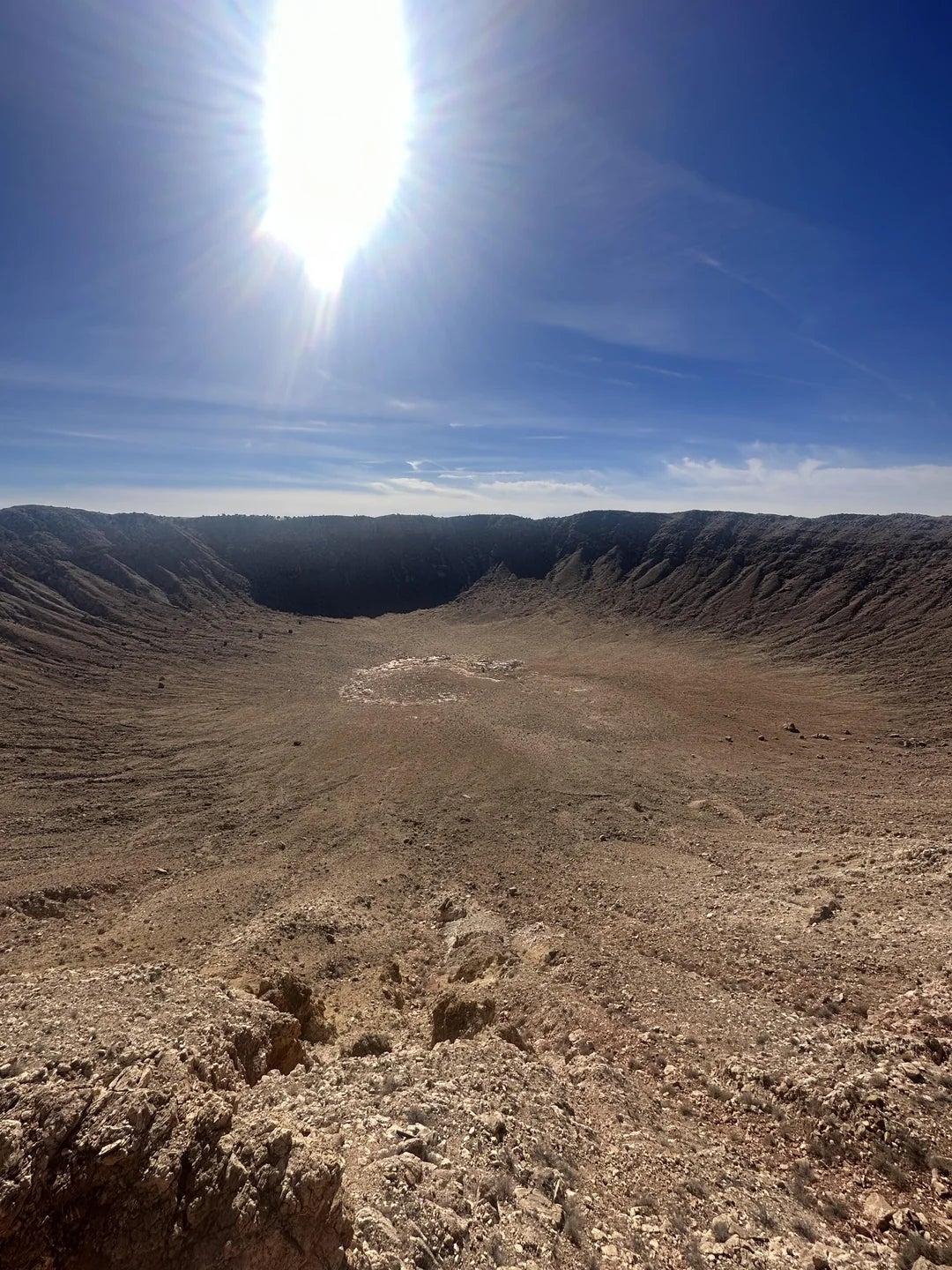 Large crater nether  a agleam  prima   successful  a barren, rocky landscape, creating heavy  shadows and melodramatic  textures