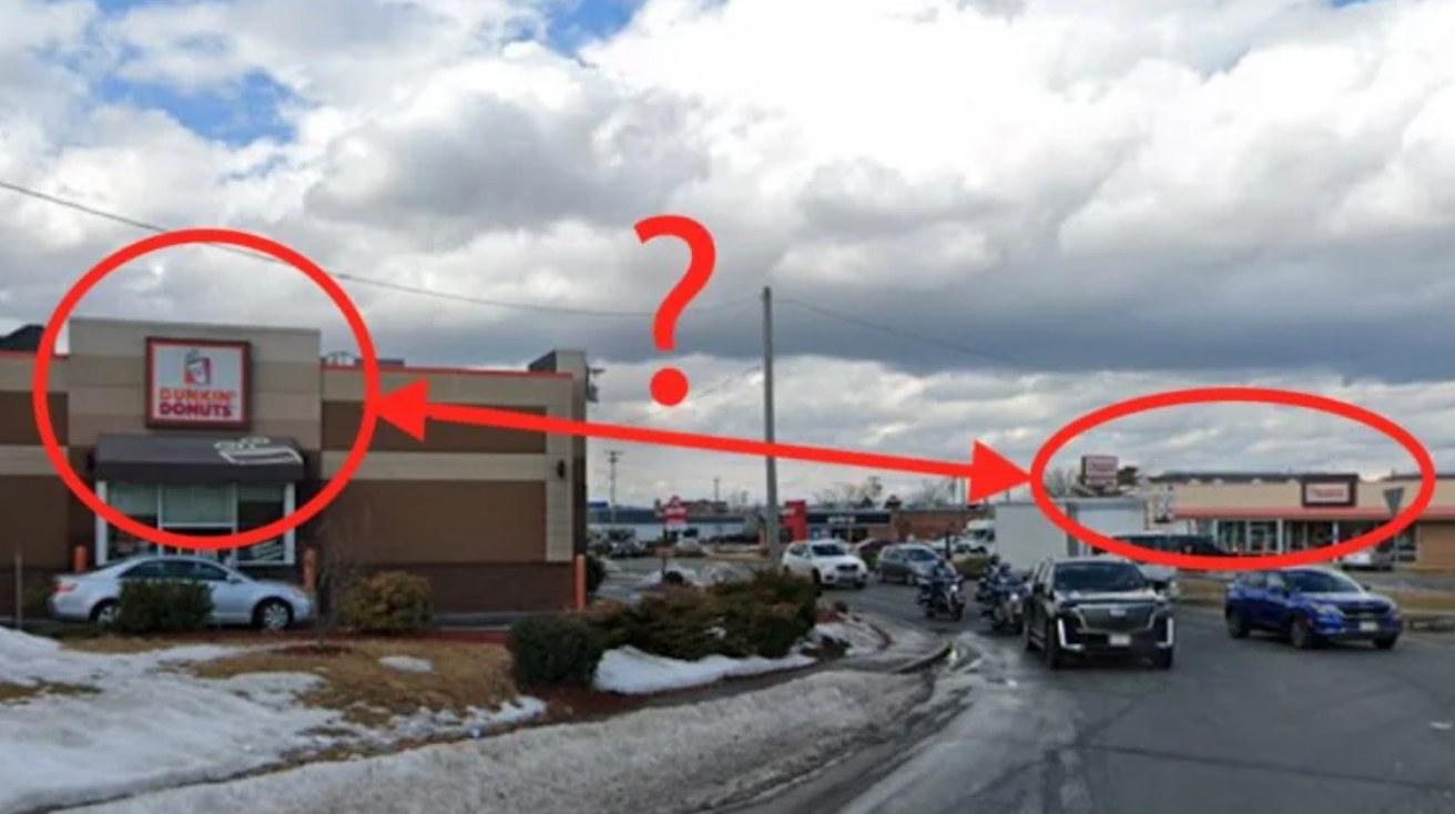 Two Burger King signs connected  adjacent buildings are highlighted with arrows and a question   mark, indicating the adjacent  proximity of the 2  locations