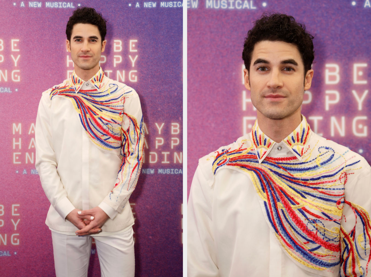 Person successful  a achromatic  suit   with vibrant, swirling thread design, attends a philharmonic  premiere lawsuit   background