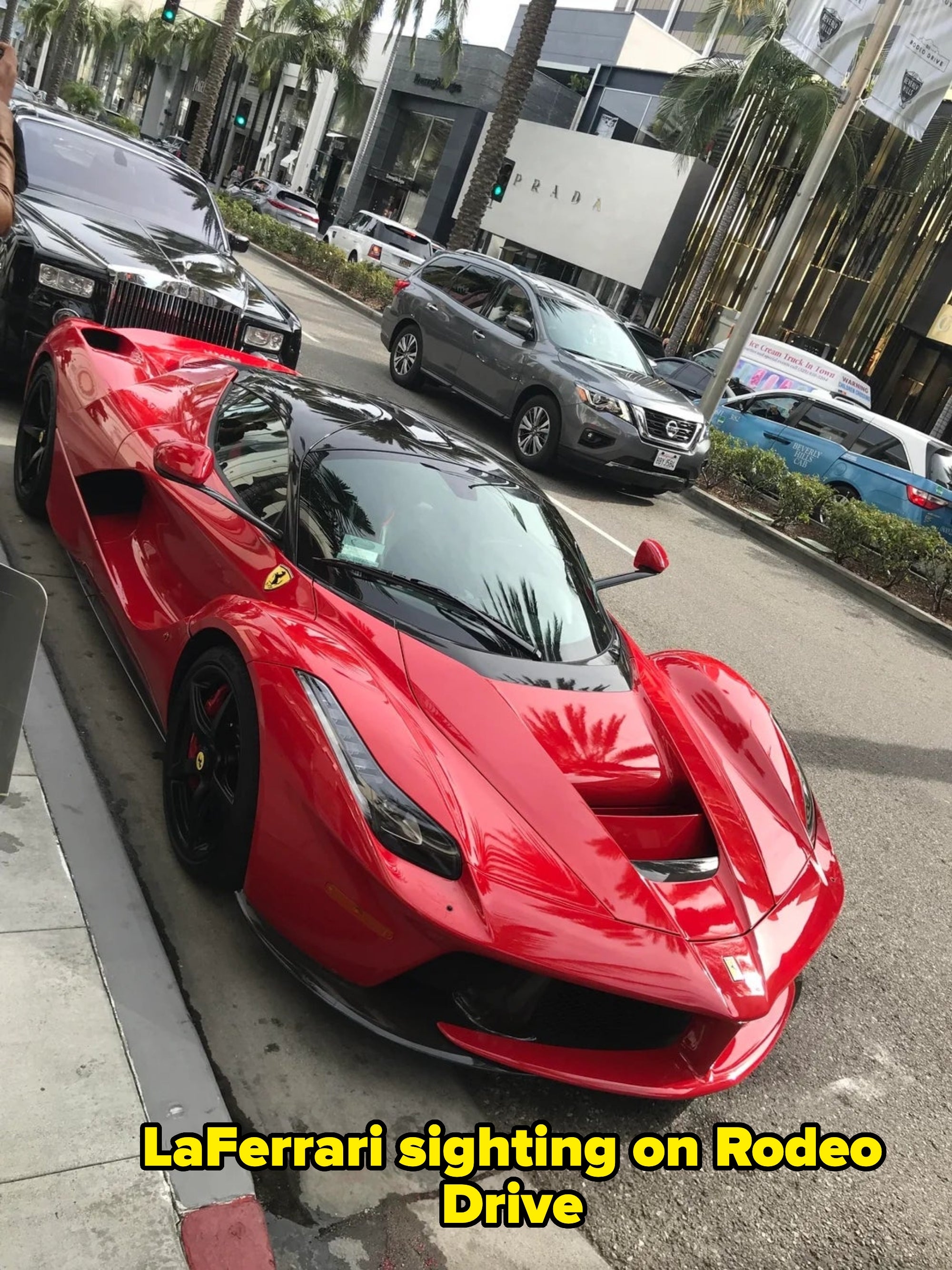 A sleek sports car   is parked connected  an upscale street, surrounded by luxury vehicles and high-end stores