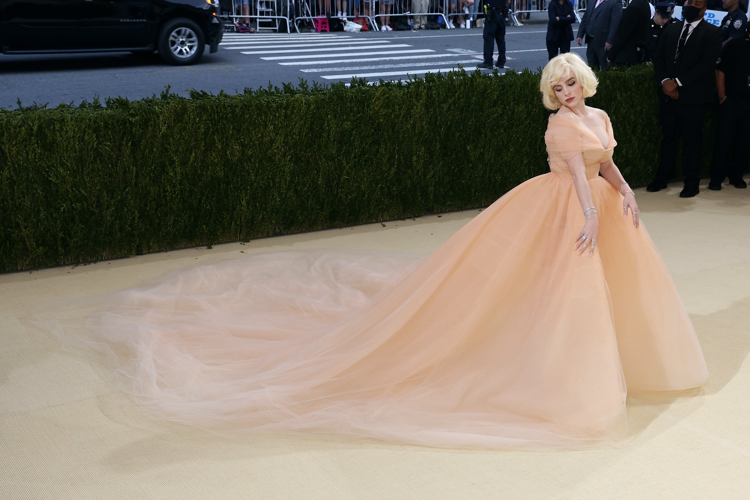 Celebrity connected  a reddish  carpet successful  an elegant gown with a full, flowing skirt and classical  styling