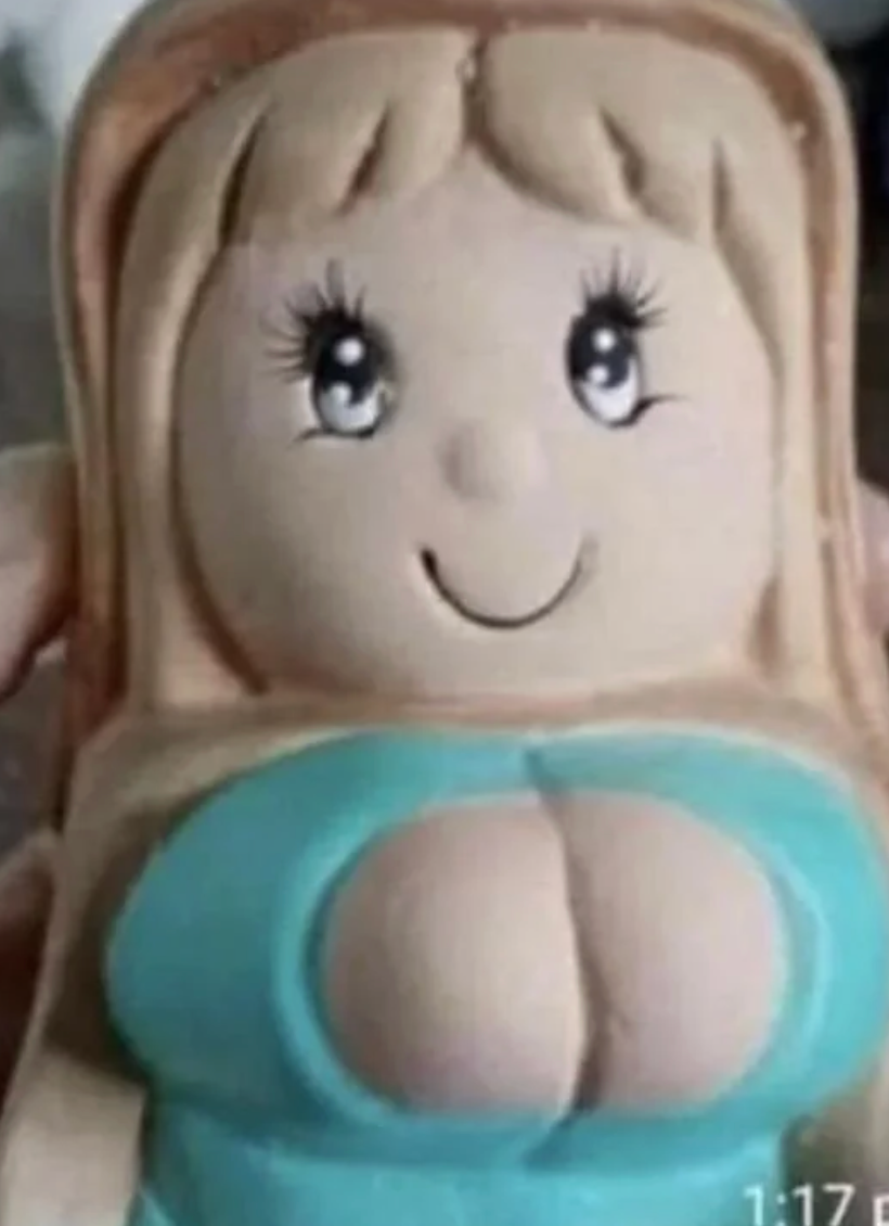 A doll with long hair and a teal top, featuring exaggerated facial features and expressions