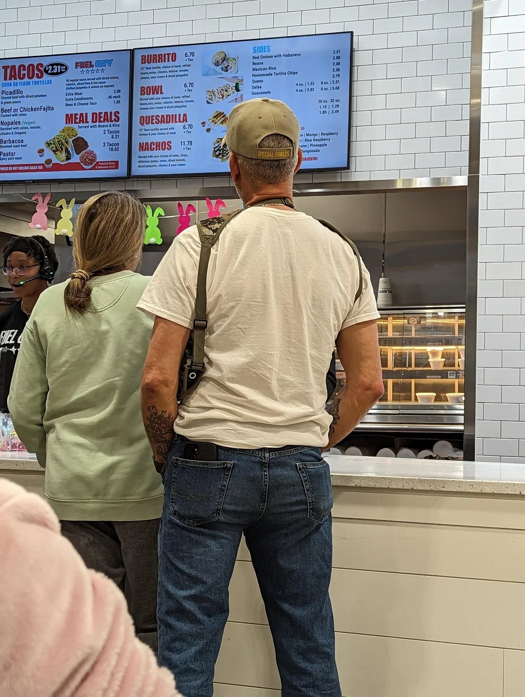 Two radical   basal   astatine  a taco store  counter, viewing the paper   overhead