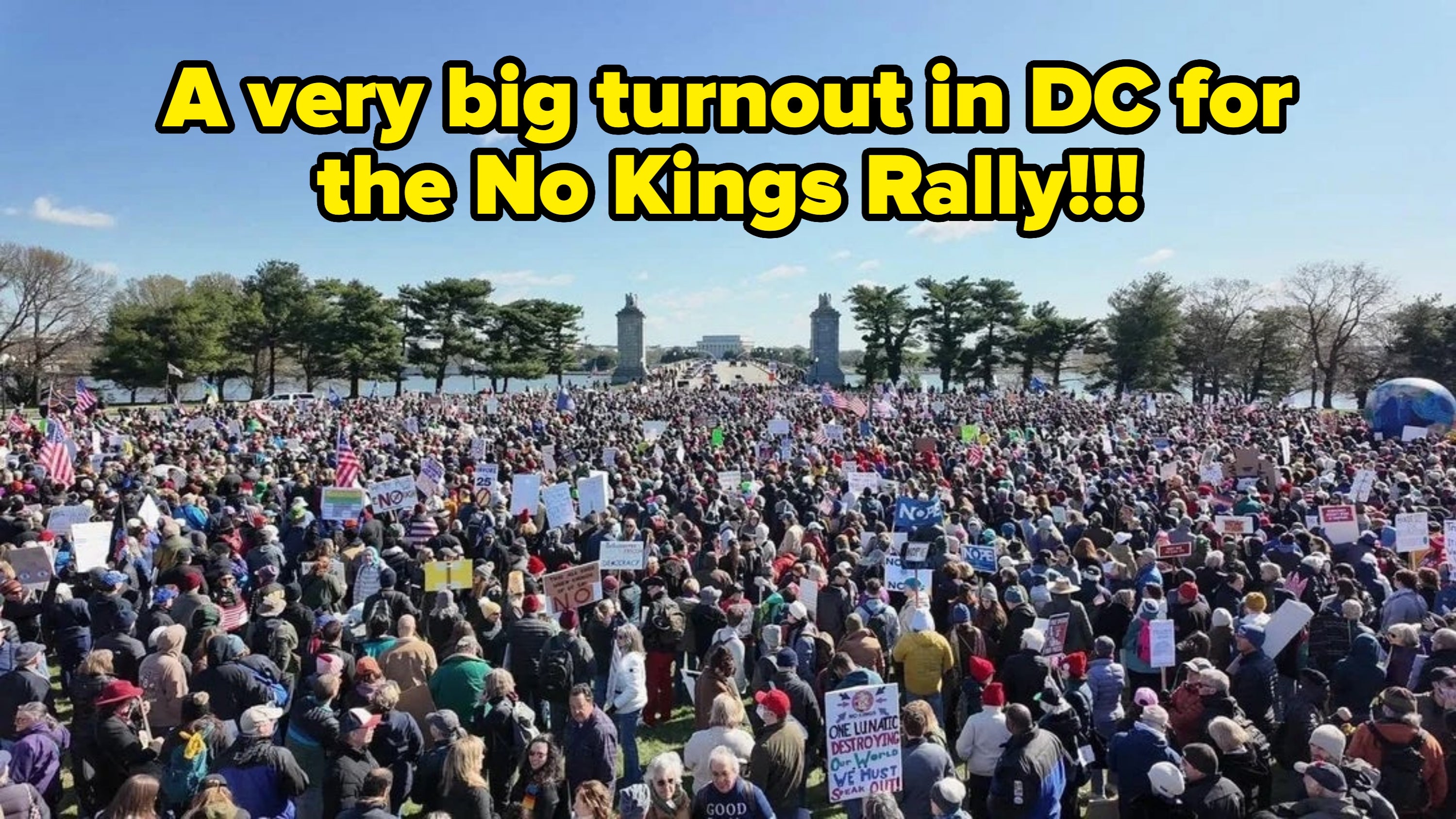 Large assemblage  of radical   gathered astatine  a rally, holding assorted  signs and banners, with trees and a wide   entity  successful  the background