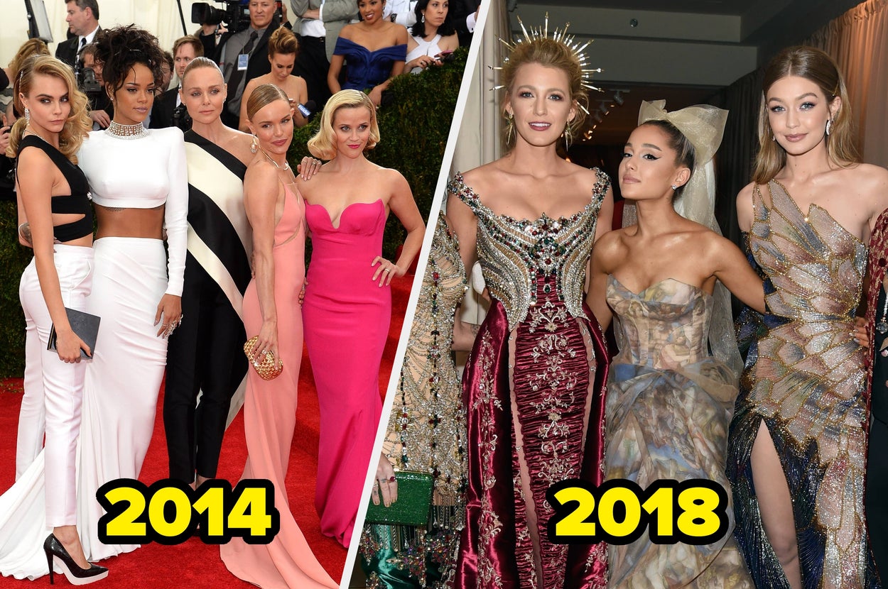 Three people in elaborate gowns at a fashion event. The attire features intricate designs and bold patterns, creating an elegant and glamorous look