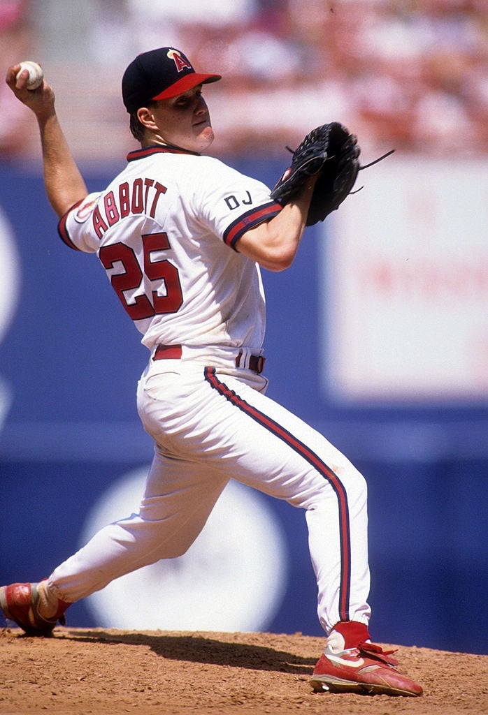 Baseball subordinate    successful  a pitching stance connected  a field, wearing a azygous   with "Abbott 25" connected  the back