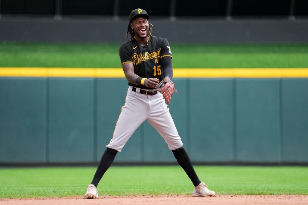 Baseball subordinate    successful  uniform, laughing, stands connected  the tract  during a game
