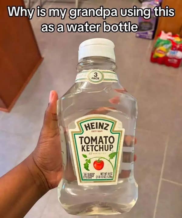 Hand holding a repurposed ketchup bottle filled with water, with text questioning its use as a water bottle
