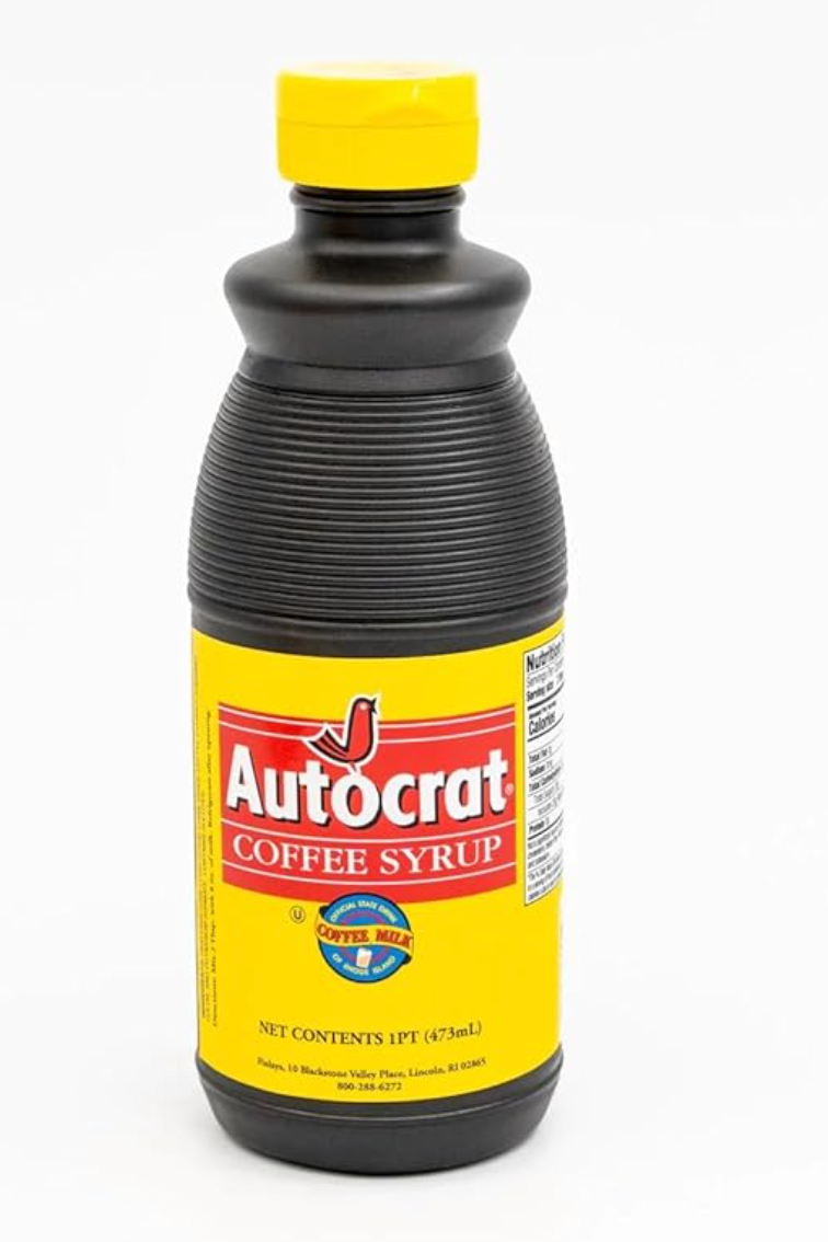 Bottle of Autocrat java syrup with yellowish and reddish label, utilized for making java milk, a fashionable portion successful Rhode Island