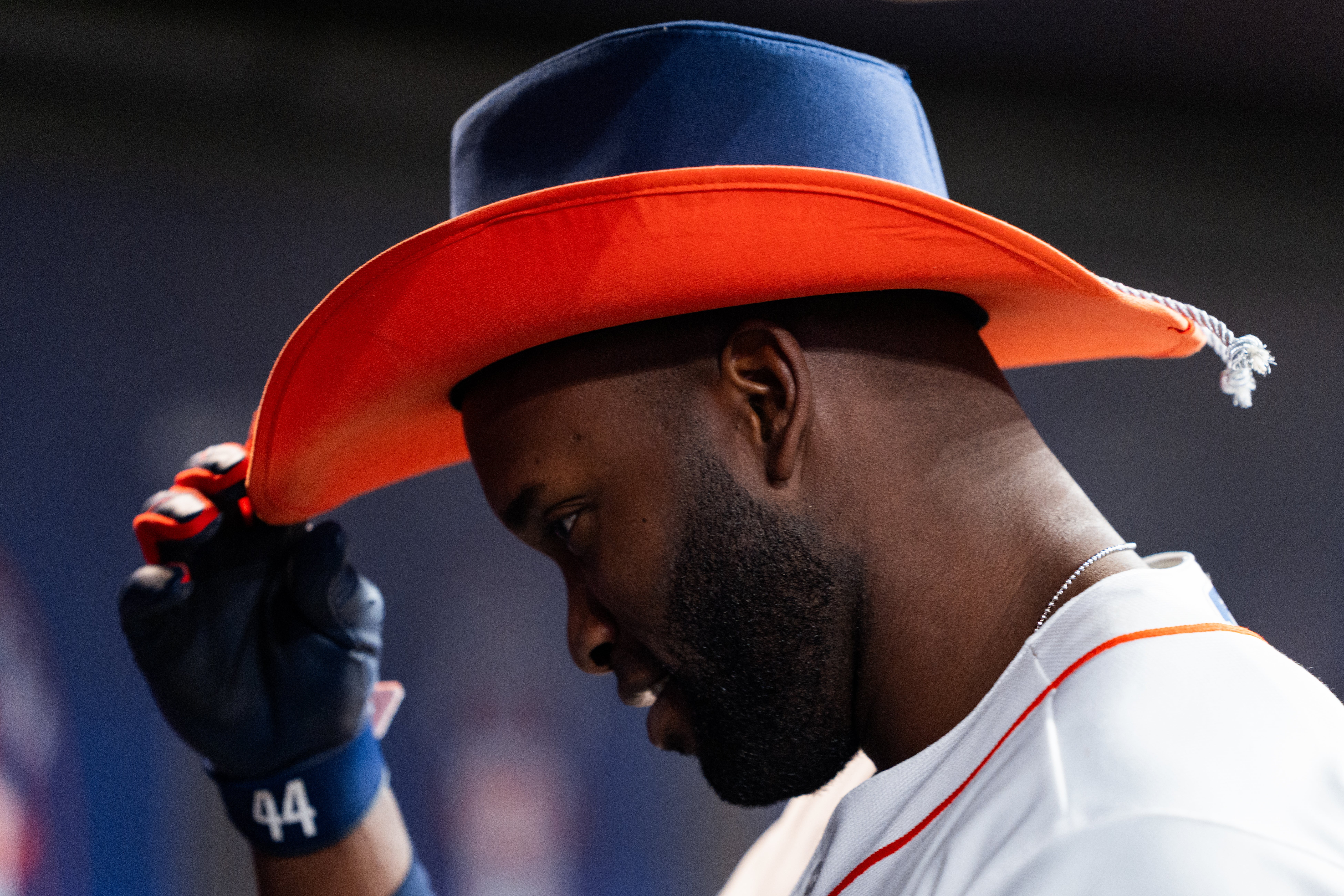 Person successful illustration wearing a cowboy chapeau and a sports jersey
