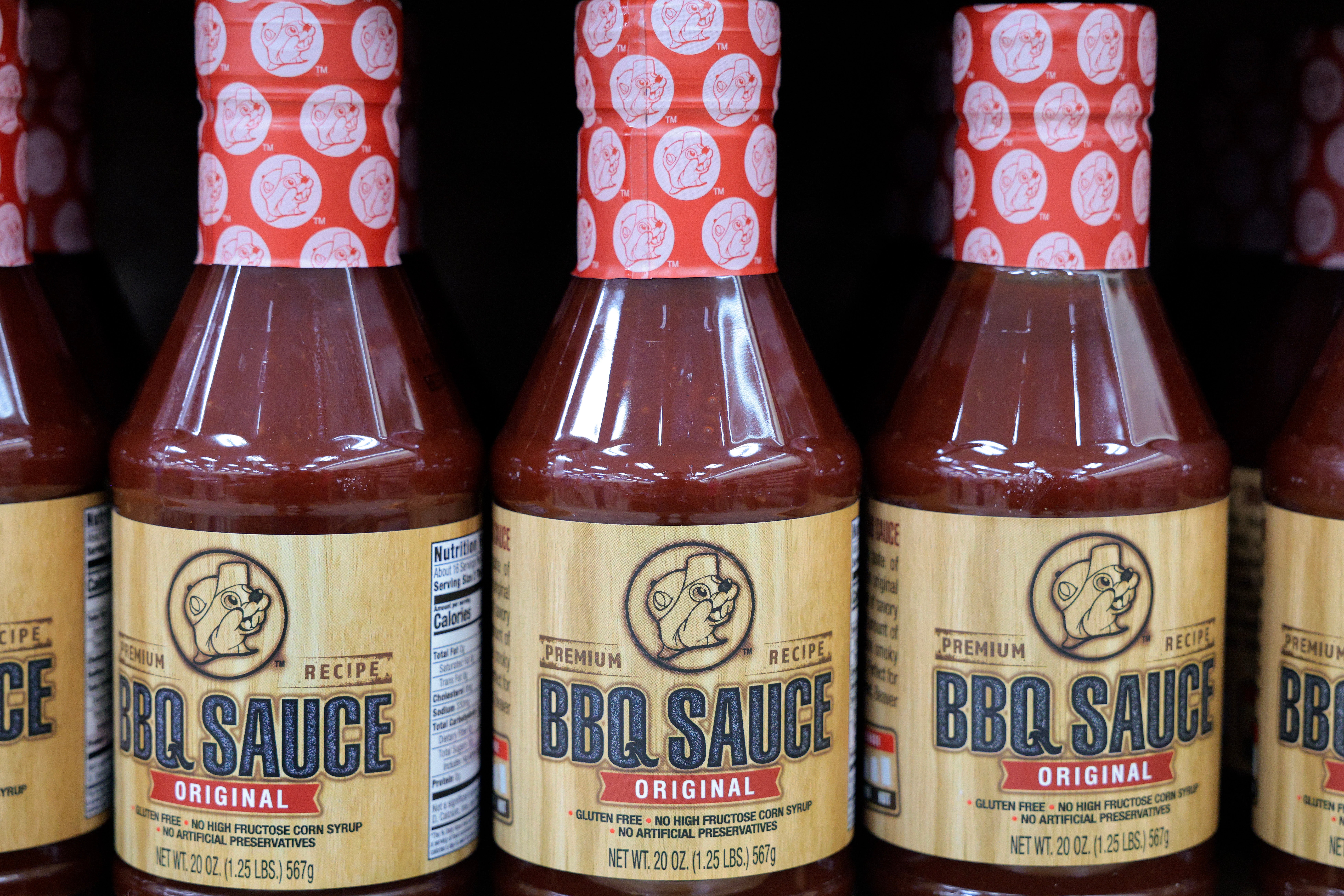 Bottles of BBQ condiment connected a store shelf, labeled "Original Recipe."