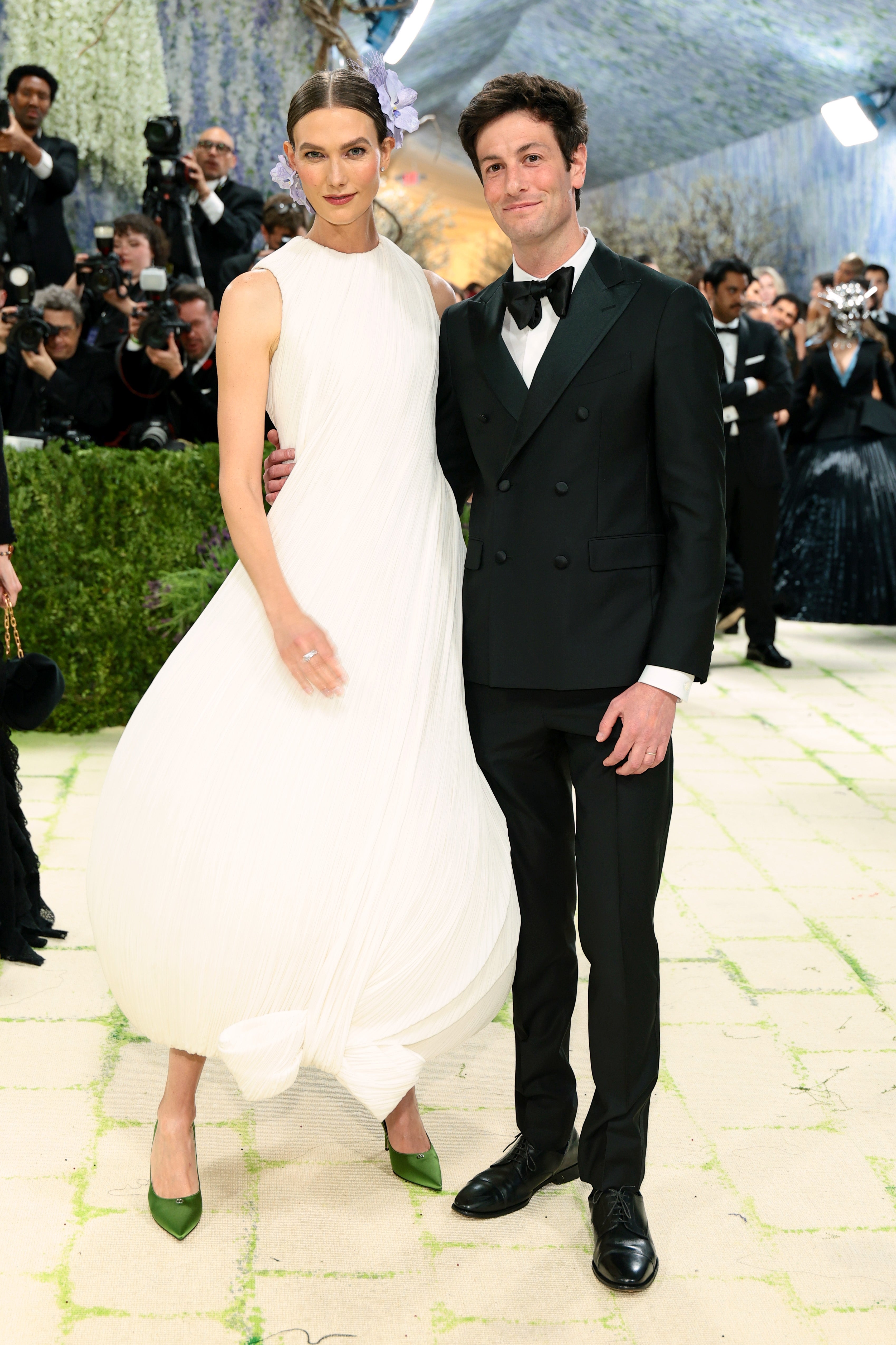 Karlie and Joshua Kushner connected  a reddish  carpet