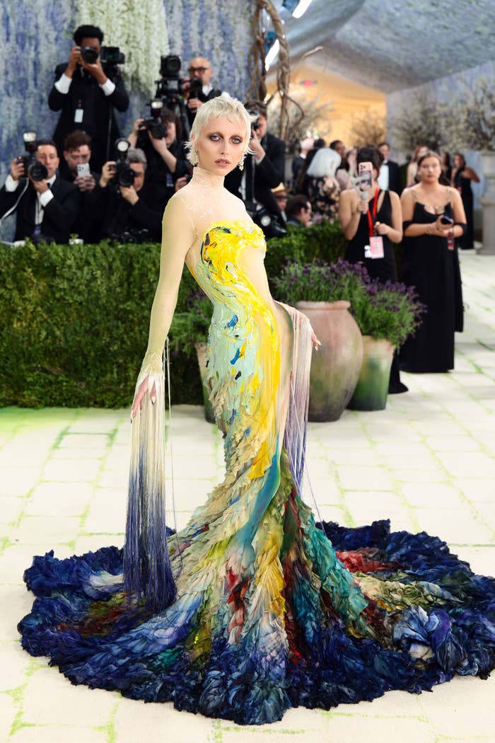 Emma Chamberlain successful  an artistic, flowing gown with intricate texture and patterns