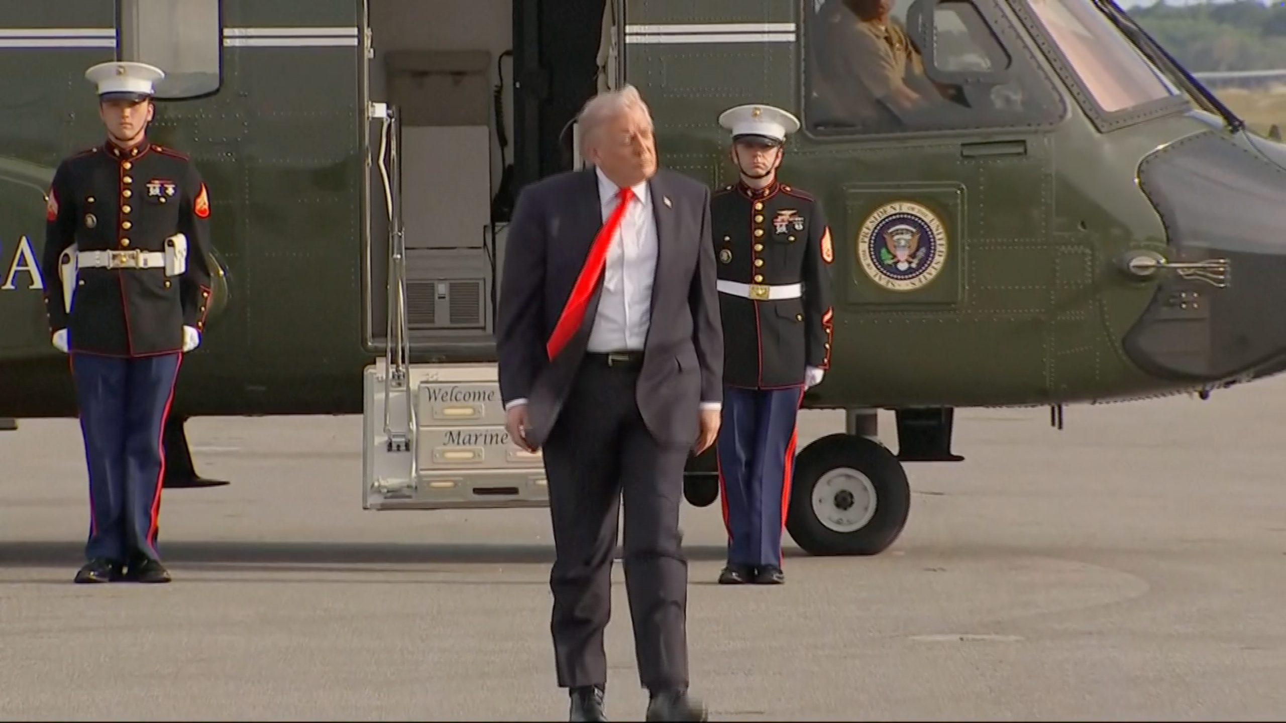 A antheral   successful  a suit   exits a chopper  with subject   unit   lasting  guard