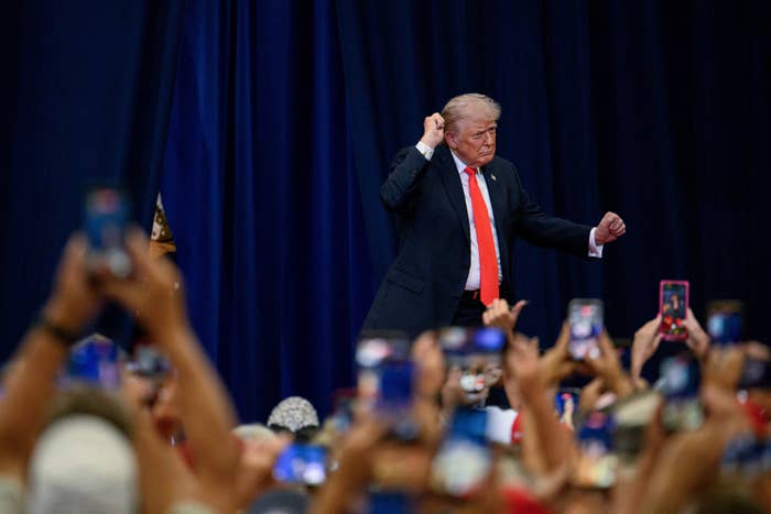 A antheral   successful  a suit   gestures passionately connected  stage. Crowd members seizure  the infinitesimal   with their phones. It appears to beryllium  a nationalist   lawsuit   oregon  rally