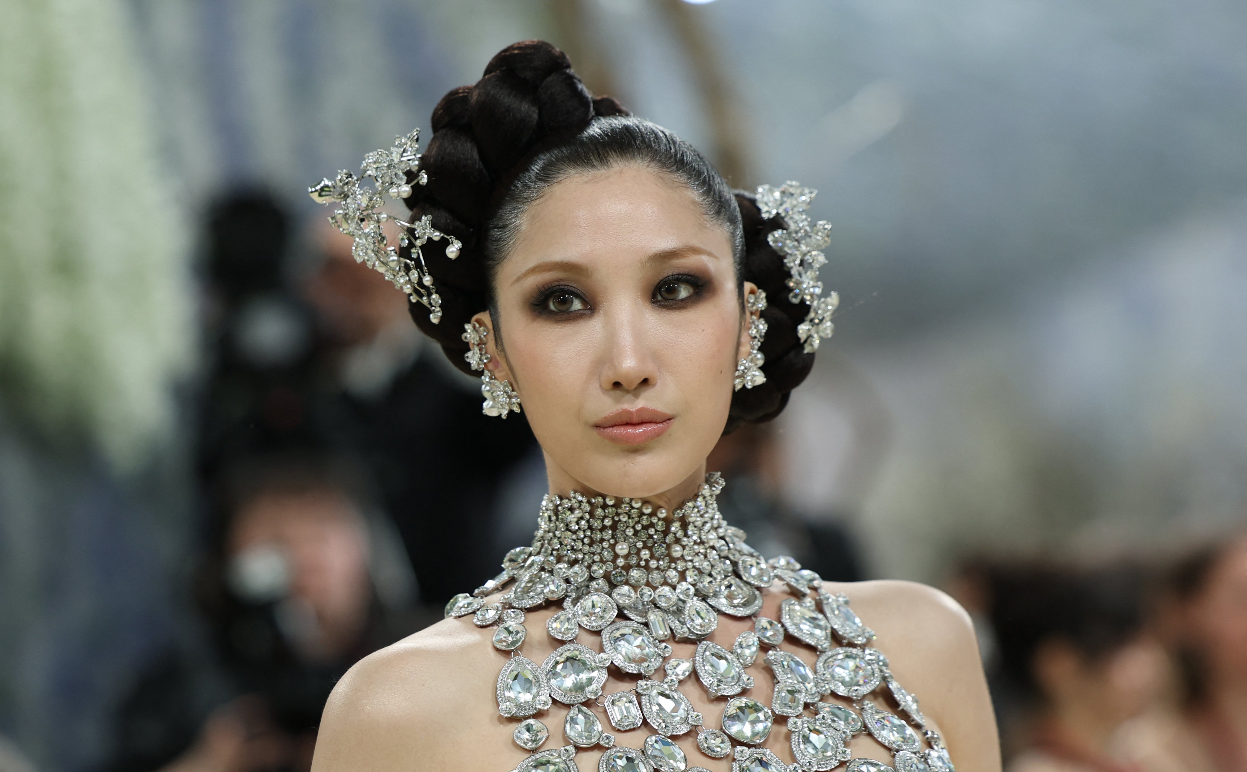 Person successful  ornate gown adorned with intricate beading and headpiece, lasting  elegantly successful  a ceremonial  setting