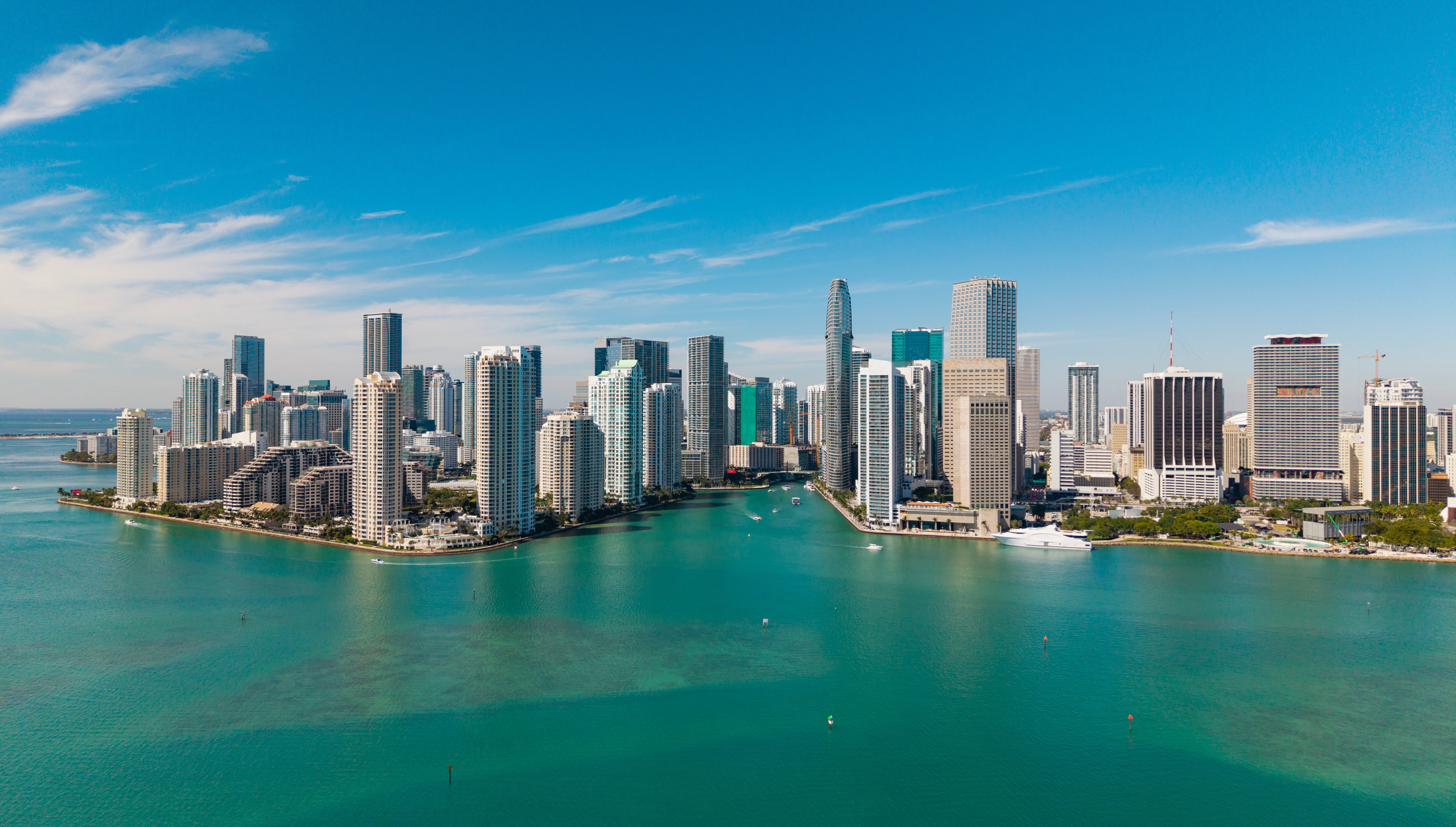 Aerial presumption    of a metropolis  skyline with gangly  buildings adjacent   a assemblage  of h2o  nether  a wide   sky
