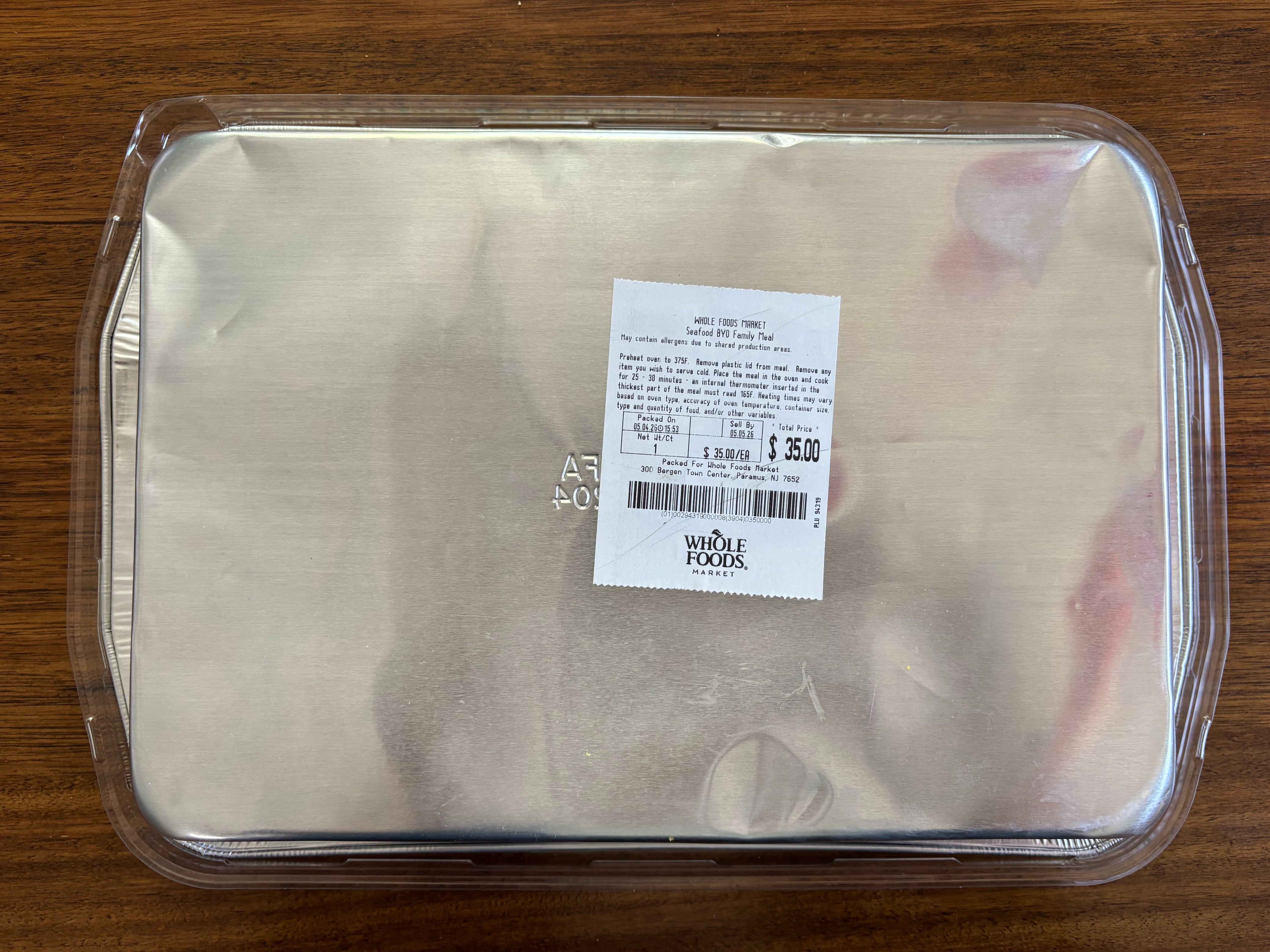 Bottom of disposable food tray with price sticker