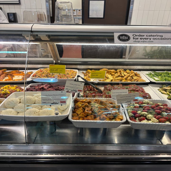 Deli counter displaying assorted prepared foods