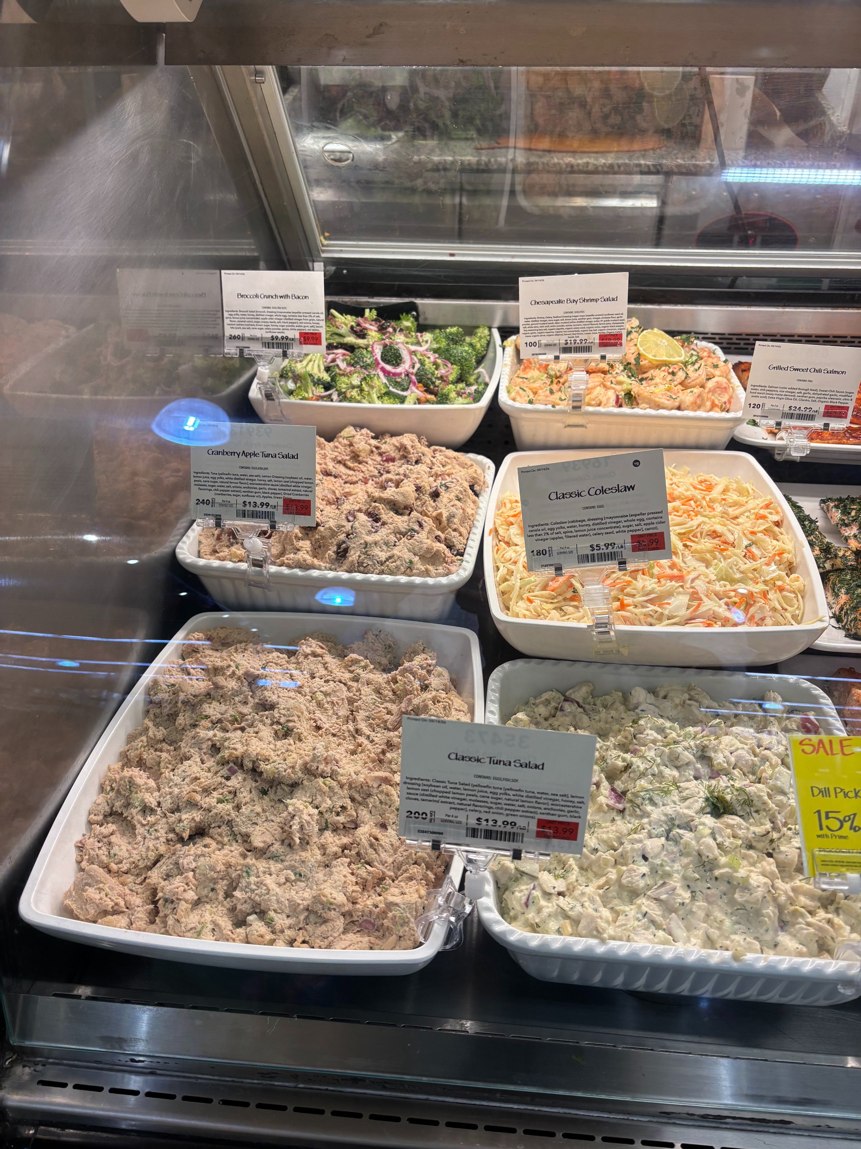Deli counter with various salads on display