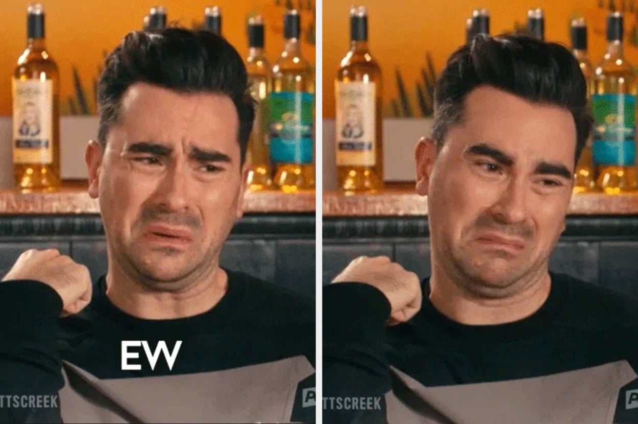 Person making an expression of disgust, captioned "EW," standing in a room with bottled beverages in the background