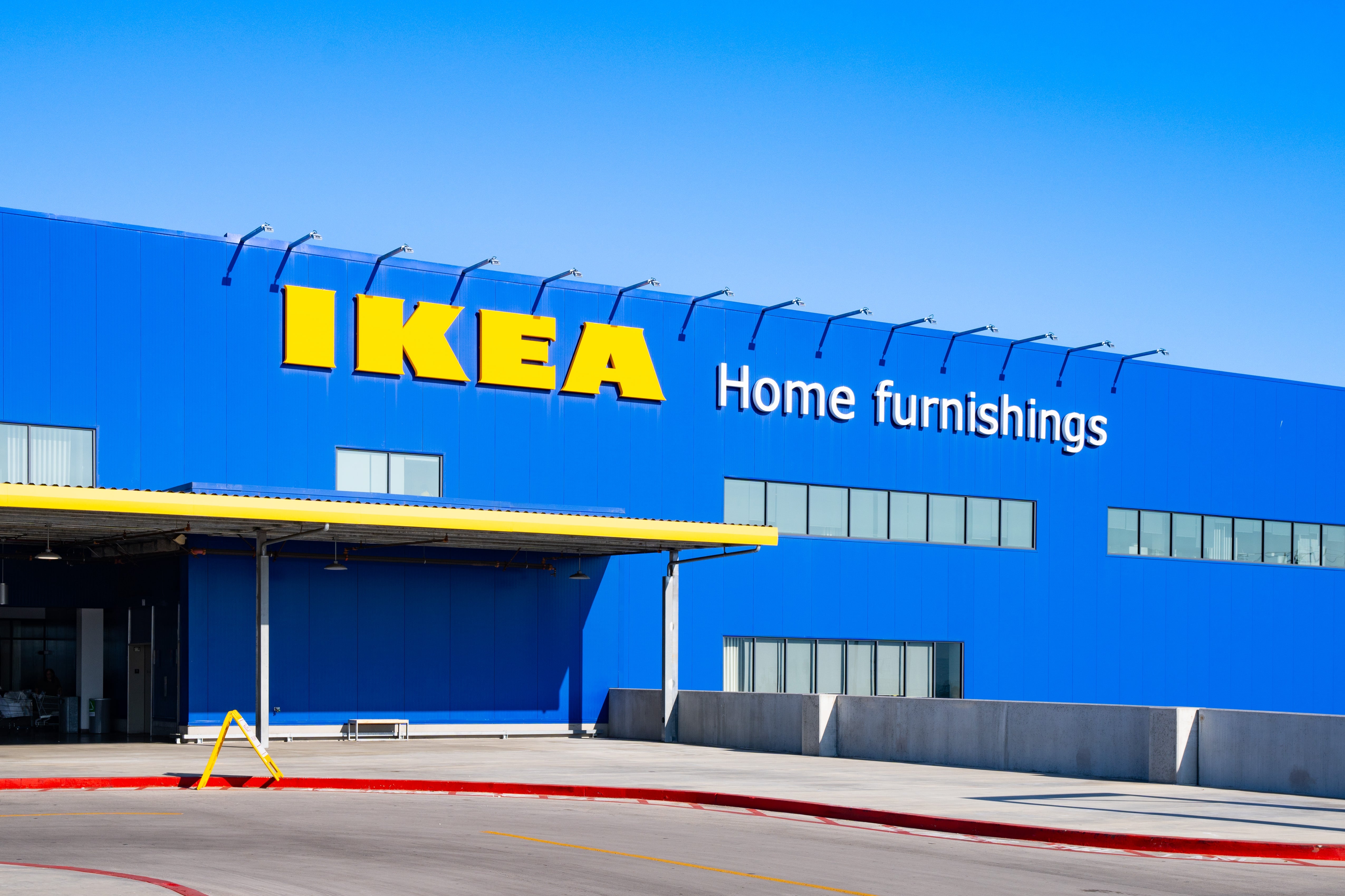 IKEA store   exterior with ample  signage saying "IKEA Home furnishings" connected  the gathering  facade