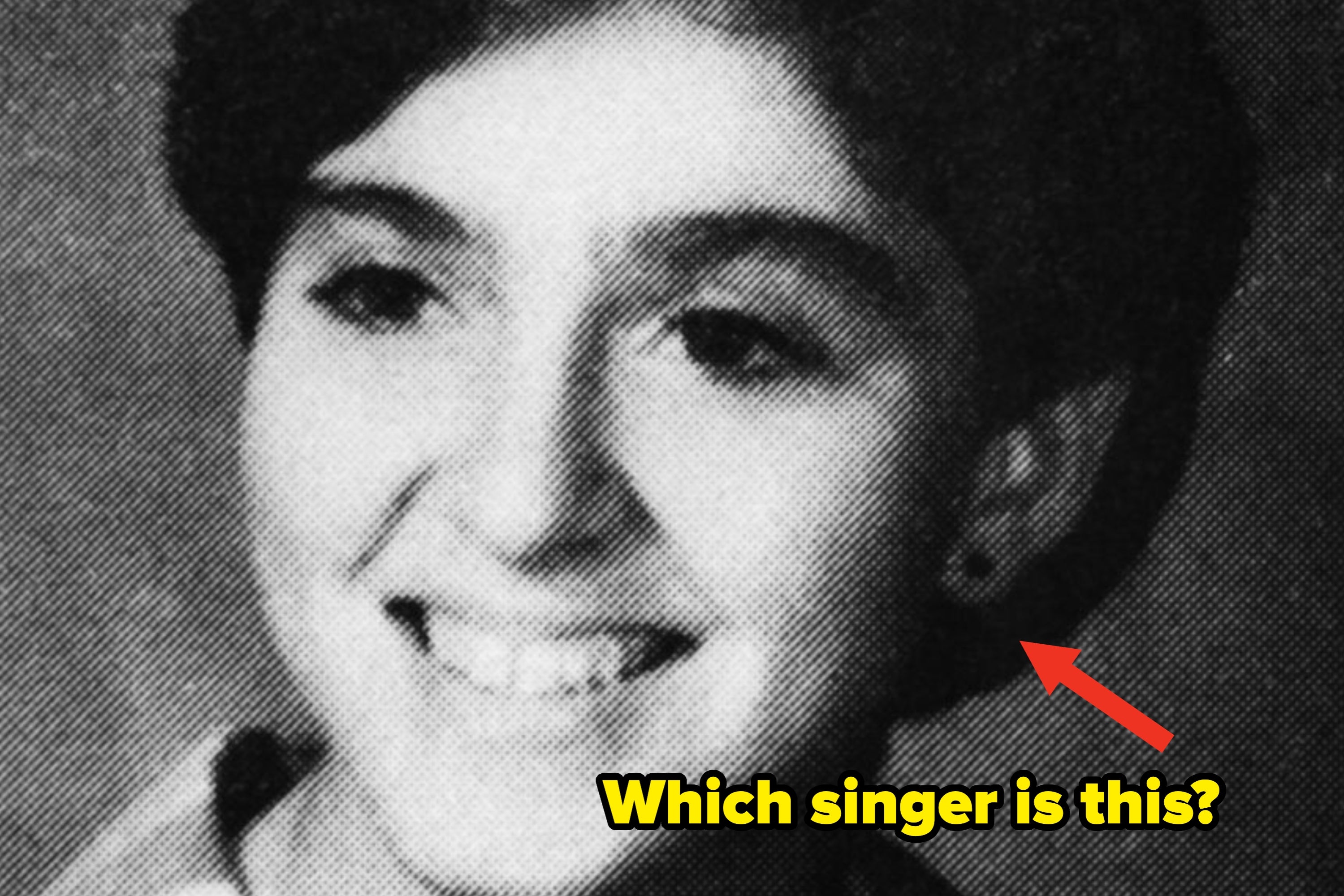 A black and white photo of a smiling person with short hair. Red arrow points to them with the text "Which singer is this?"