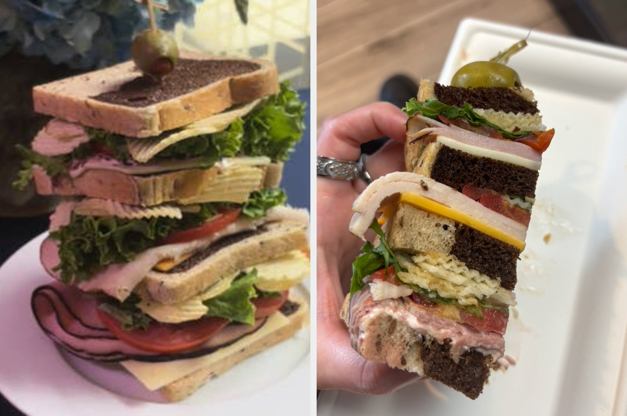 Two large, stacked sandwiches filled with various meats and cheeses