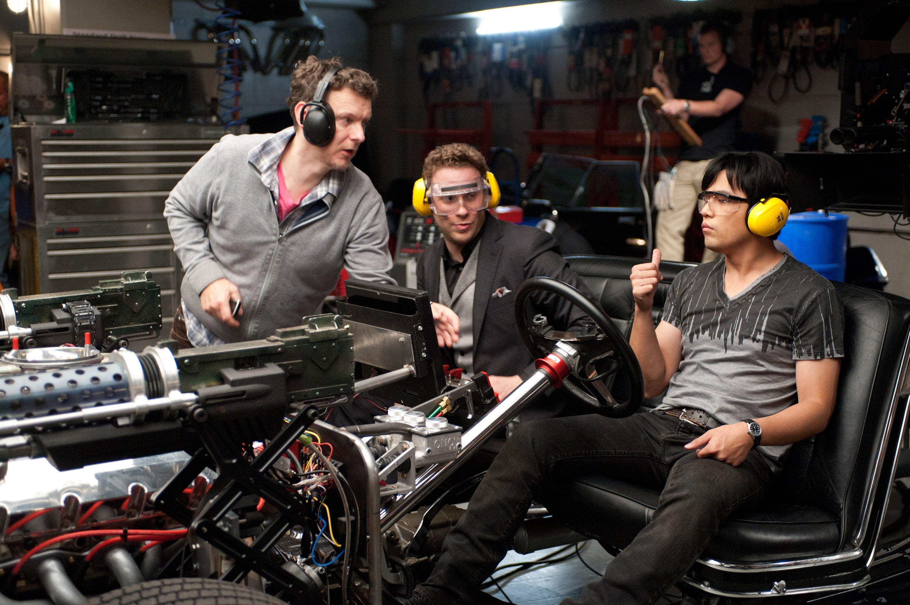 Three radical   successful  headphones and information   goggles enactment    connected  a vehicle's analyzable  motor  setup successful  a garage