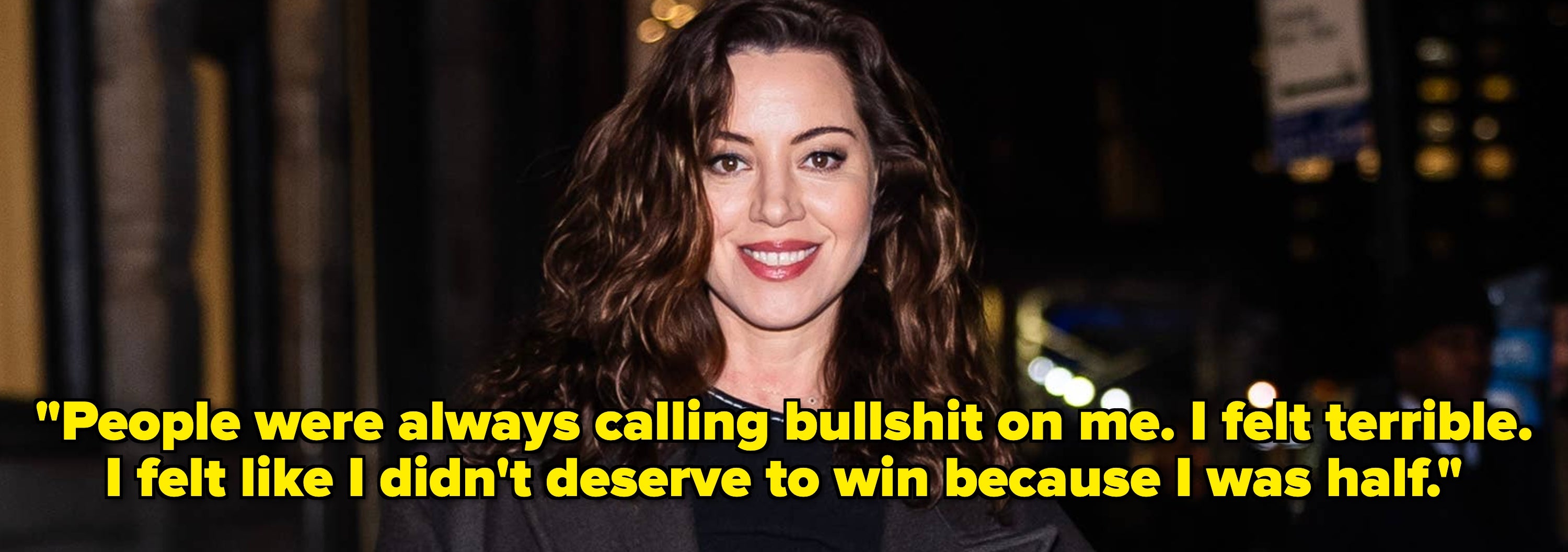 Person smiling in a structured blazer; quote about feeling undeserving of success displayed below