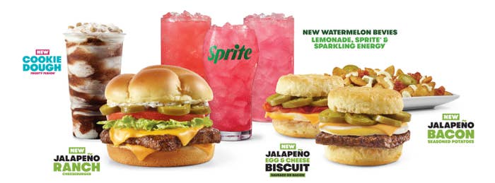 A selection of Wendy's fast food items including cookie dough Frosty Fusion, burger with jalapeños and ranch, watermelon drinks, and biscuit breakfast sandwiches with cheese, egg, and bacon