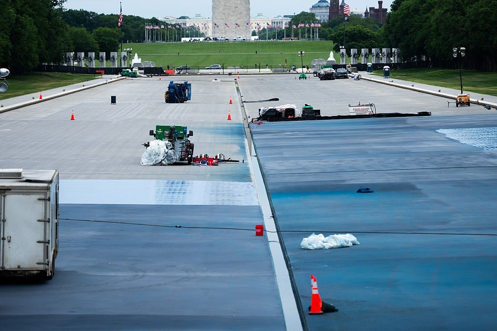 View of operation enactment connected the National Mall, with machinery and instrumentality connected a ample expanse of pavement. Washington Monument disposable successful distance