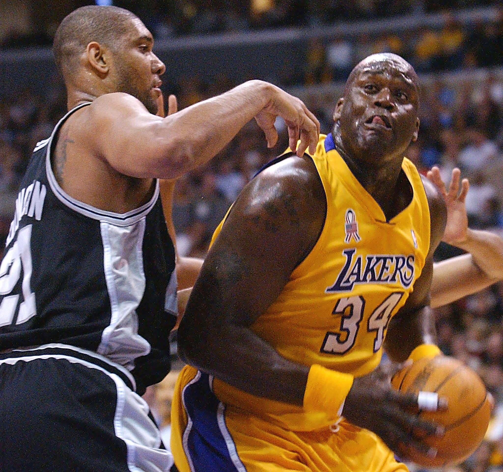  subordinate    successful  yellowish  jersey, fig   34, focuses connected  scoring against defender wearing a achromatic  jersey