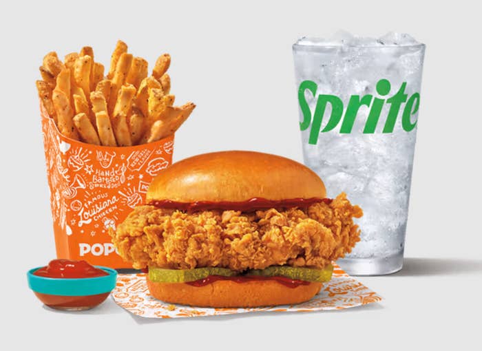 Popeyes honey BBQ sandwich with fries, ketchup and Sprite