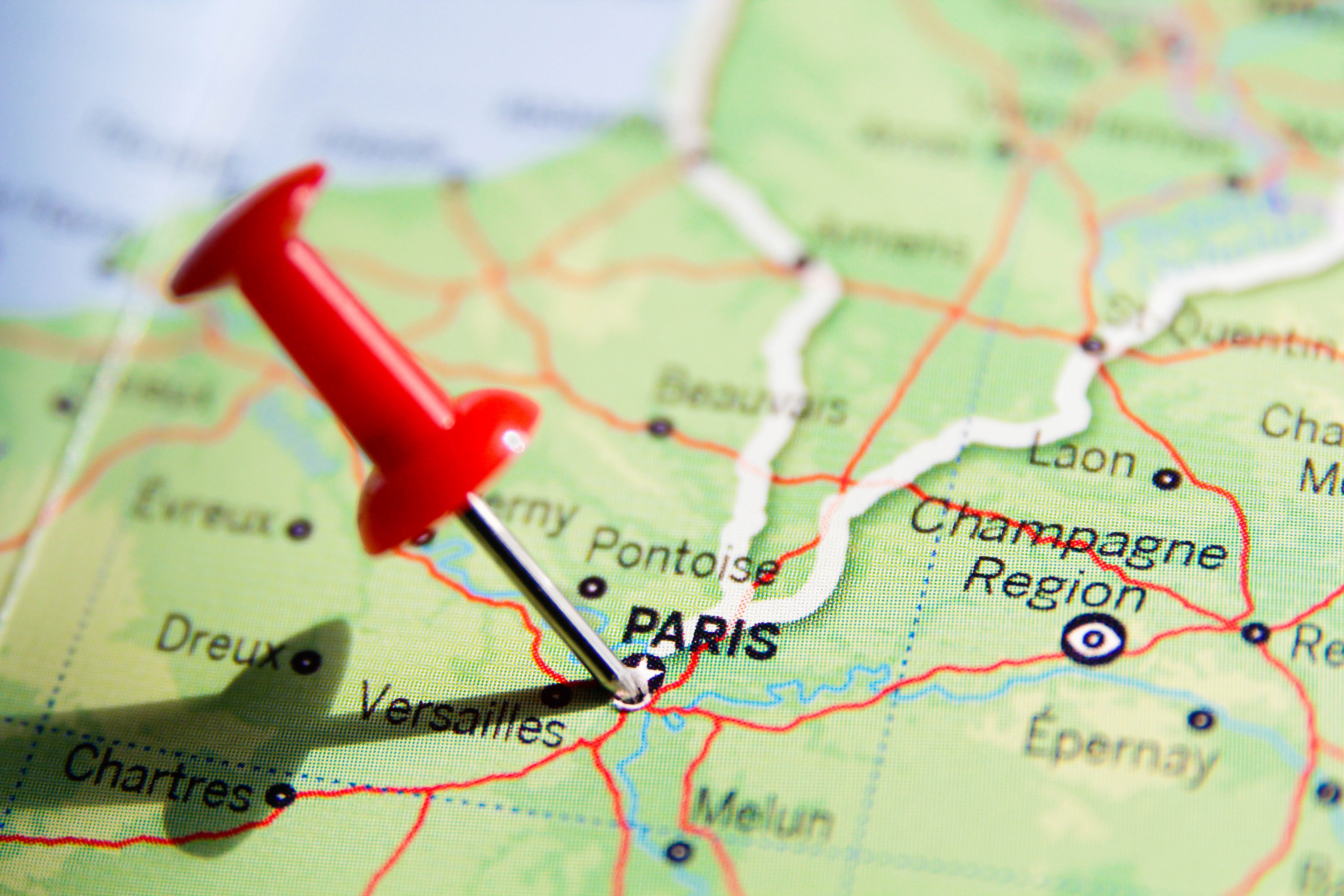 A map of northern France with a red pushpin marking Paris, indicating a focal point or destination