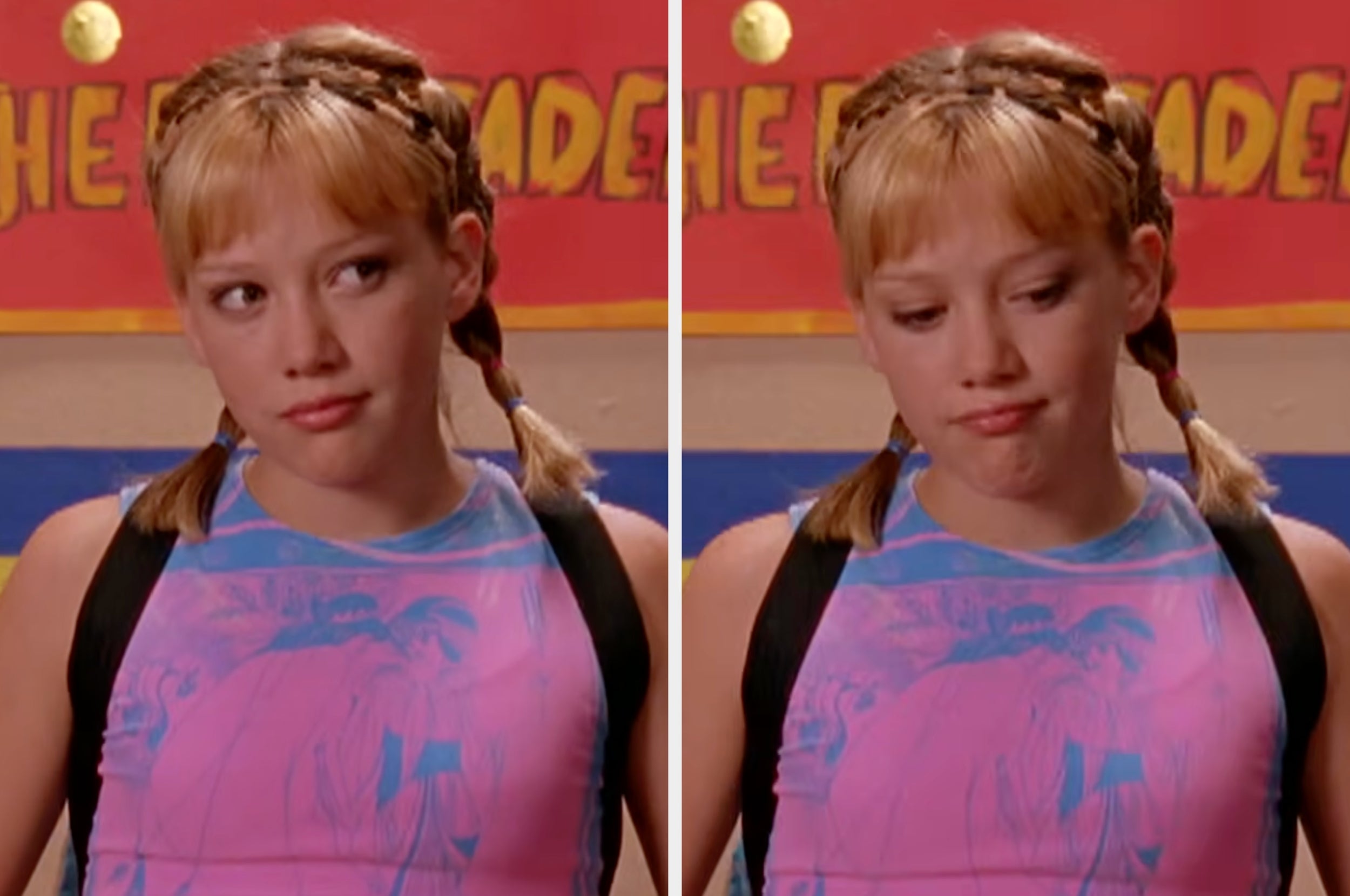 Person with braided hair looks to the side, wearing a printed top and backpack, standing in front of a colorful wall