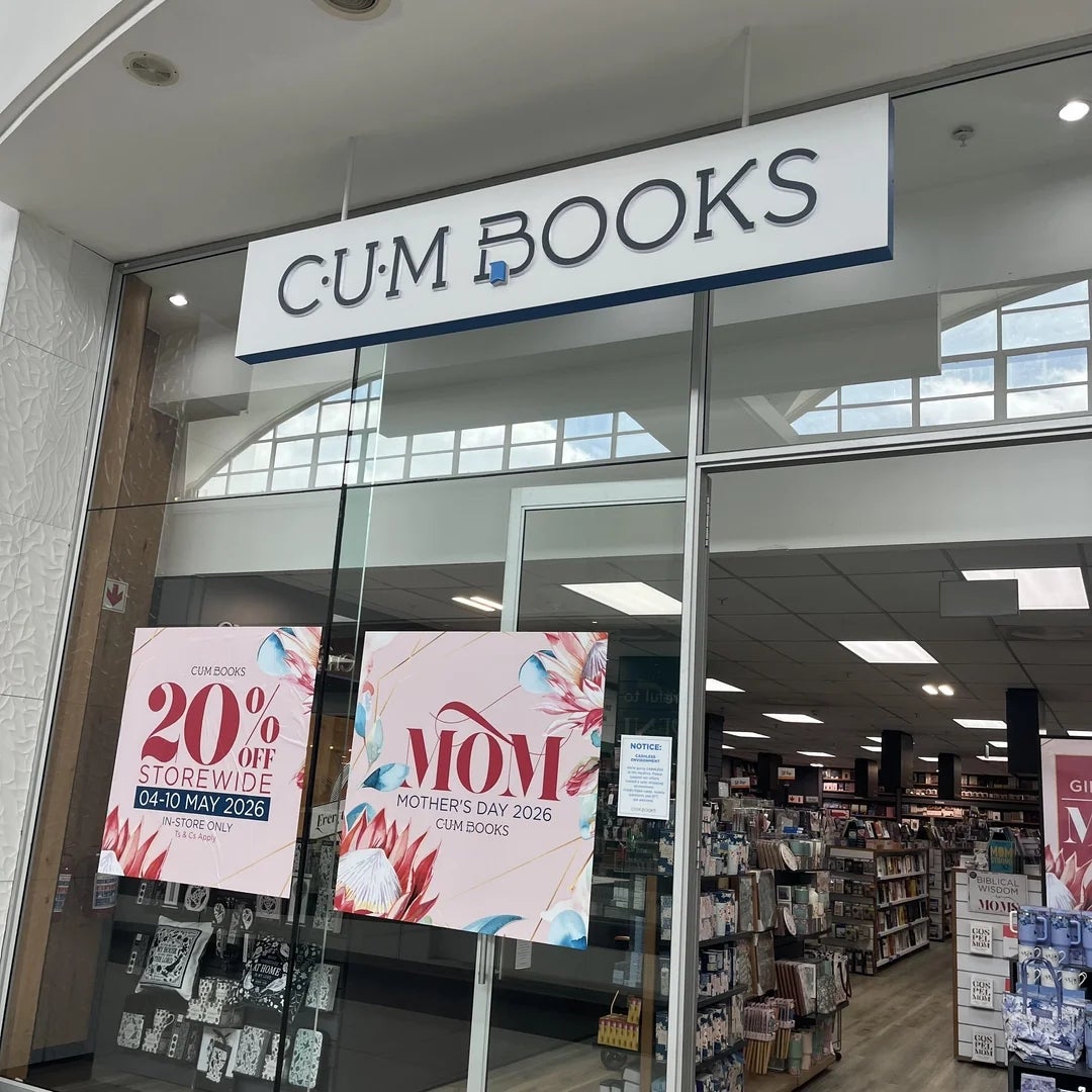 Bookstore entranceway  with signs for 20% disconnected  storewide merchantability  from May 4-10, 2026, and Mother's Day promotion