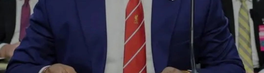 A antheral   successful  a suit   is sitting astatine  a array  during a hearing. Headline substance   mentions "Patel made 'grave mistake'" with a notation   to a lawsuit