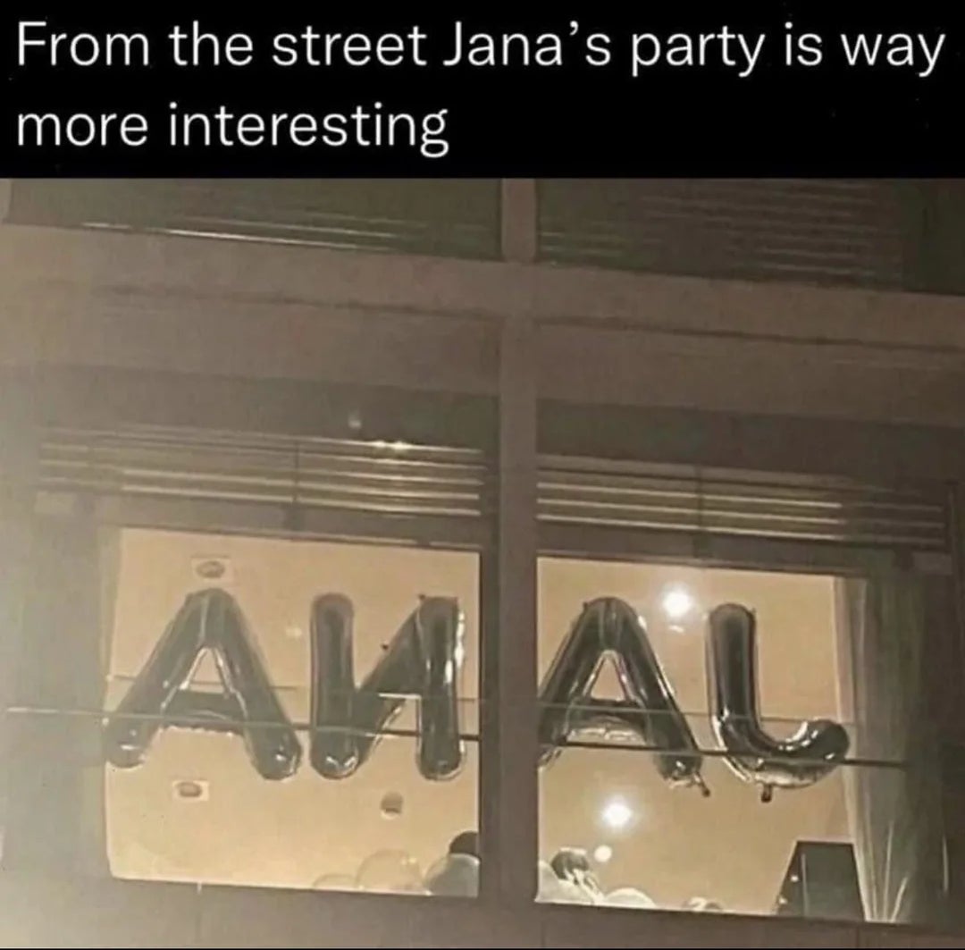 Large balloon letters spell "ANAL" from "JANA" arsenic  seen from extracurricular  a building