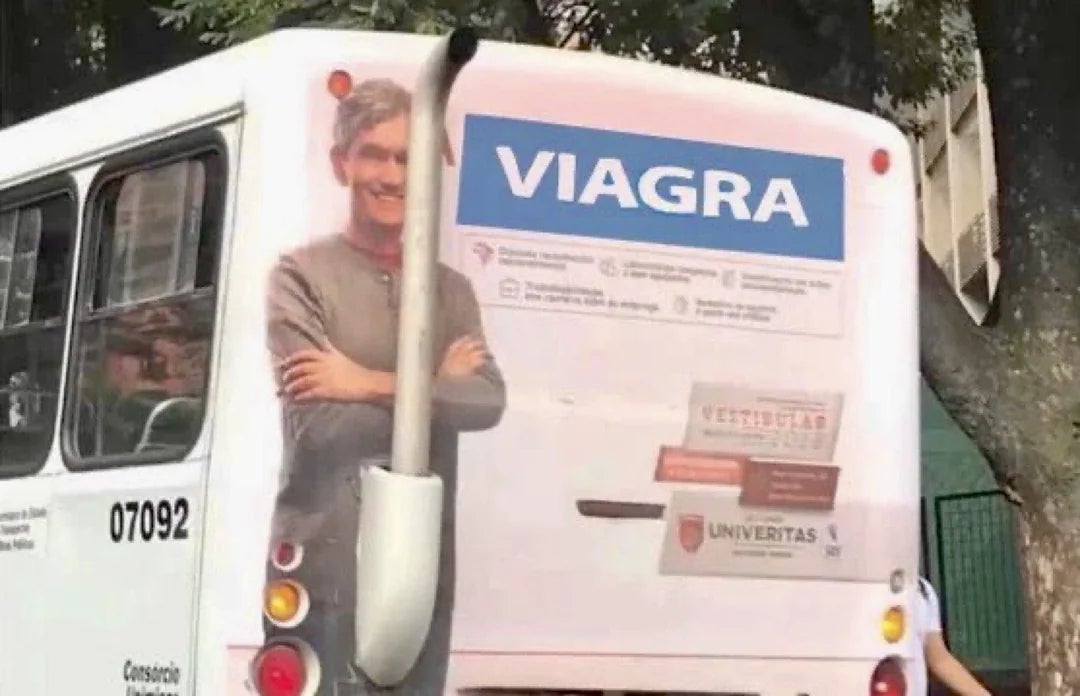 An advertisement featuring a antheral   lasting  confidently is placed connected  a bus, promoting Viagra with pill packages shown
