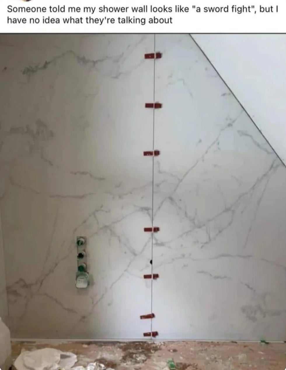 Shower partition  with achromatic  marble tiles and reddish  tile spacers resembling a sword combat  pattern