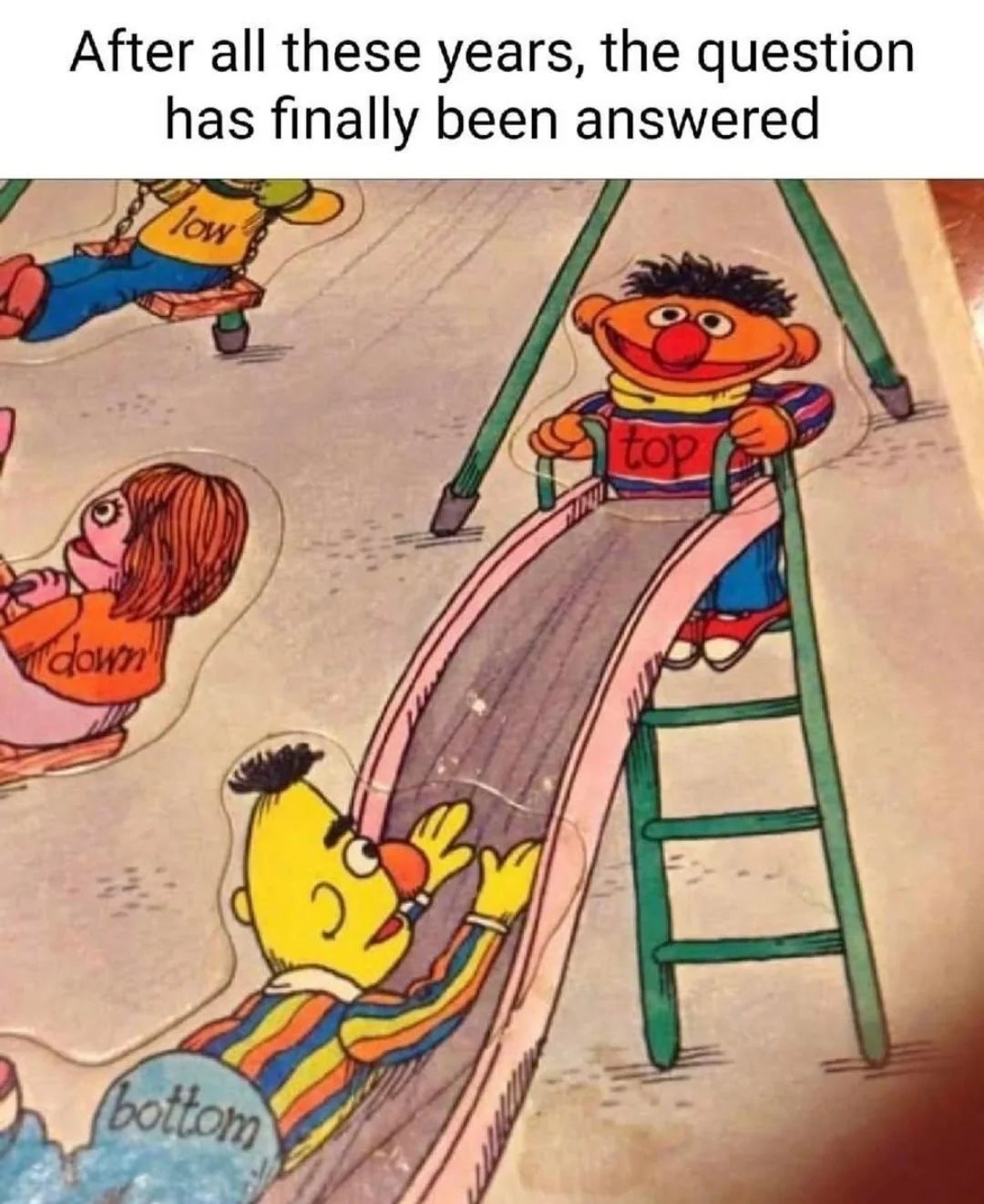 Cartoon with Bert astatine  the bottommost  of a descent  labeled "bottom" and Ernie astatine  the apical  labeled "top." Text ponders a long-awaited question