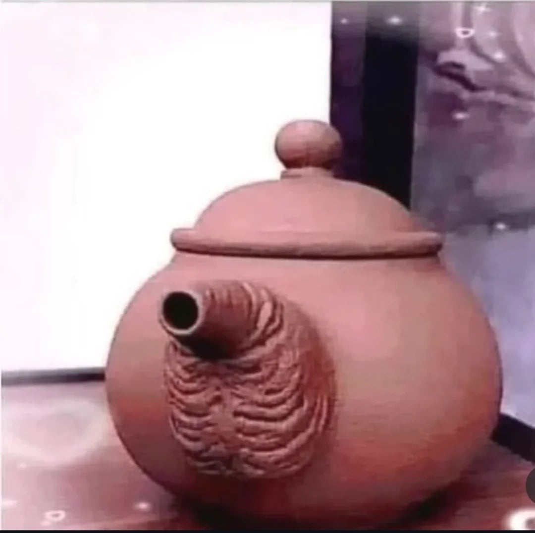 A circular  teapot with a unique, ribbed texture connected  its spout, acceptable   against a neutral background