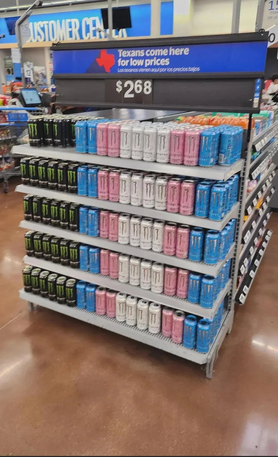 Display of vigor  drinks connected  a store   support  with a motion   promoting debased  prices for Texans