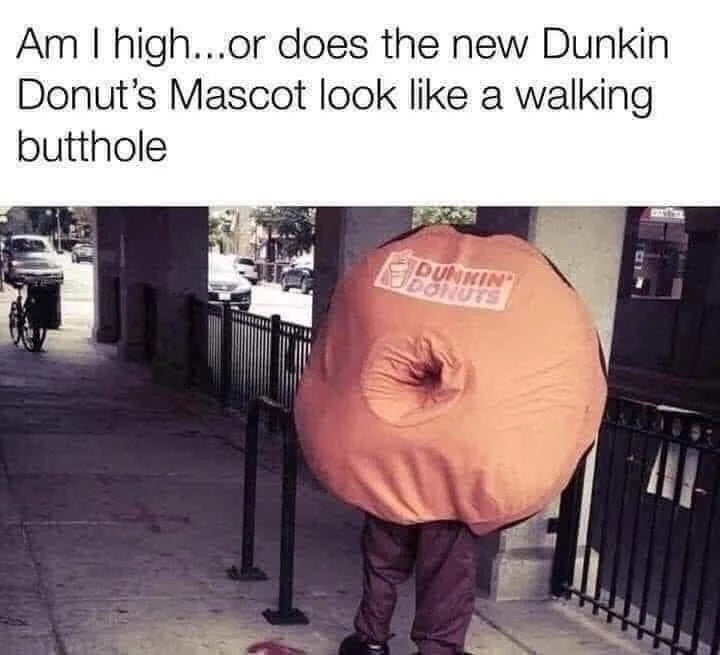A idiosyncratic   is wearing a circular  costume resembling a donut with the Dunkin' logo, alongside humorous substance   questioning its appearance