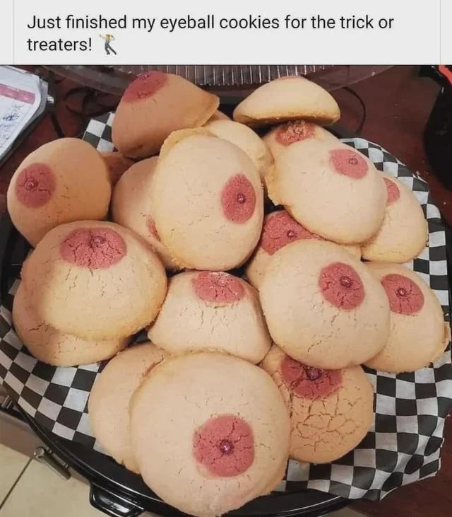 A sheet  of cookies resembling eyeballs connected  a checkered surface, with substance   astir  preparing them for trick-or-treaters
