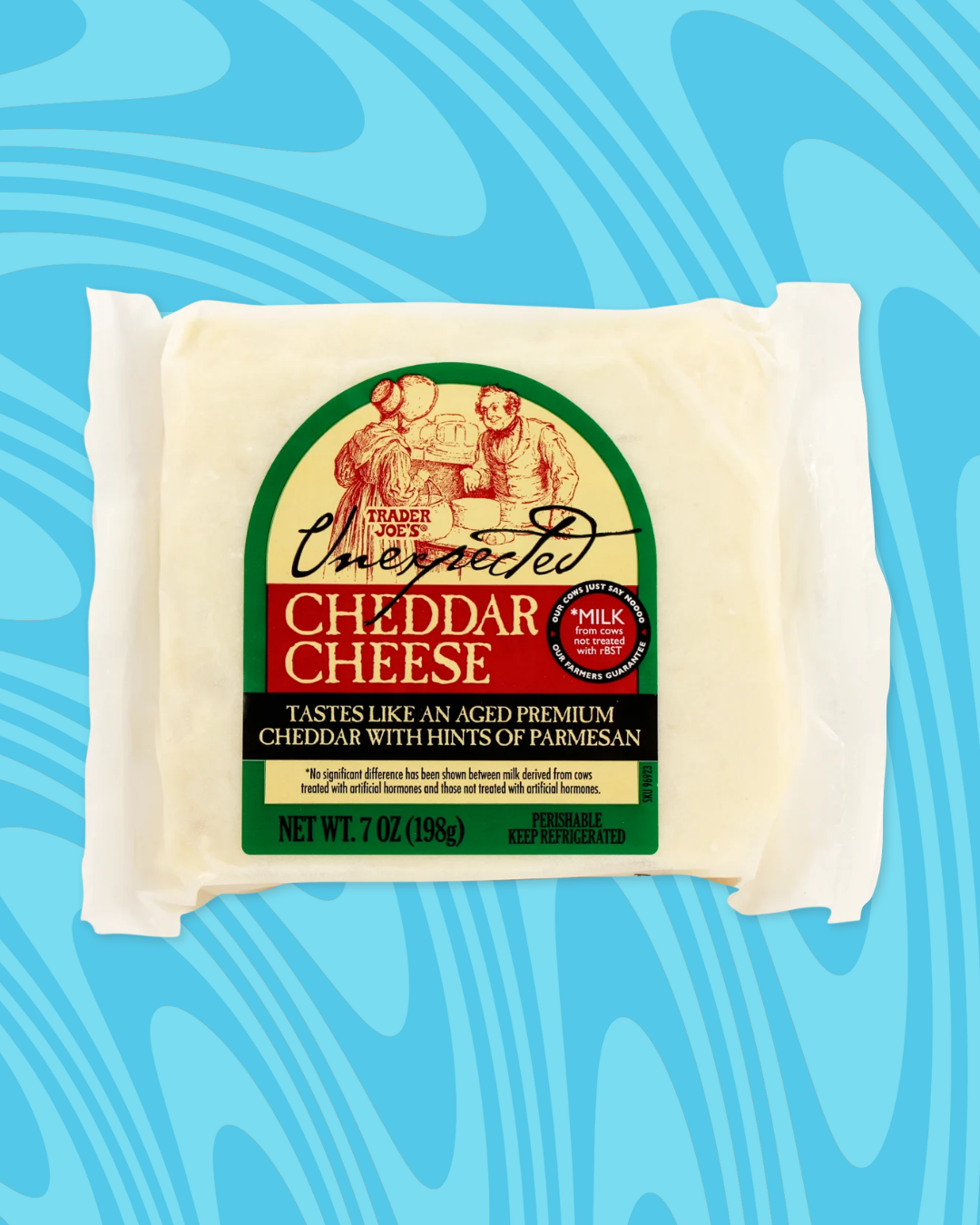 Package of Unexpected Cheddar Cheese, 7 oz. Described as aged premium cheddar with hints of Parmesan, from Trader Joe's