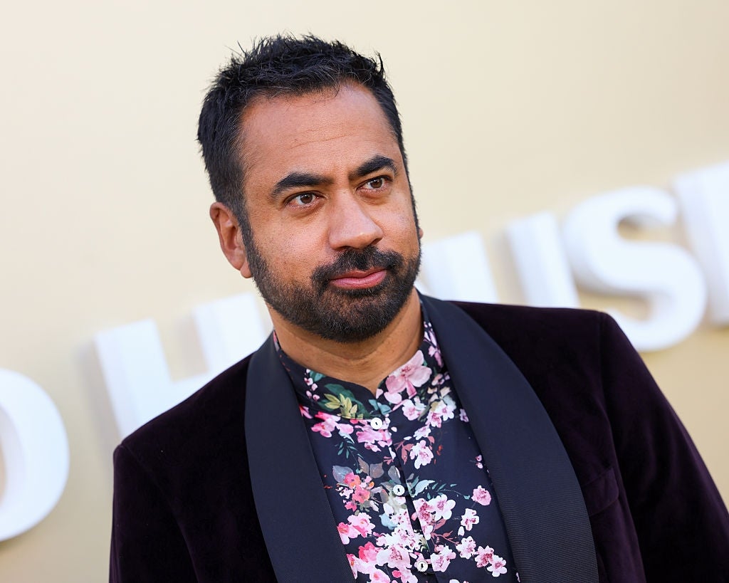Person successful  a floral garment  and acheronian  jacket, attending a ceremonial  event