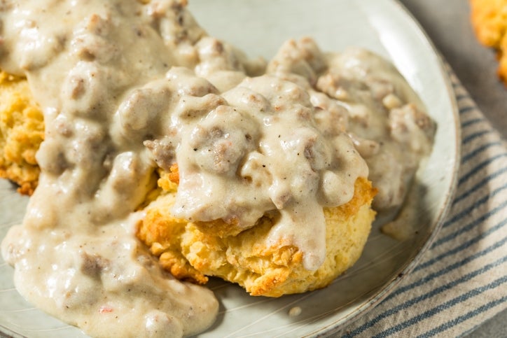 Biscuits covered in sausage gravy served on a plate